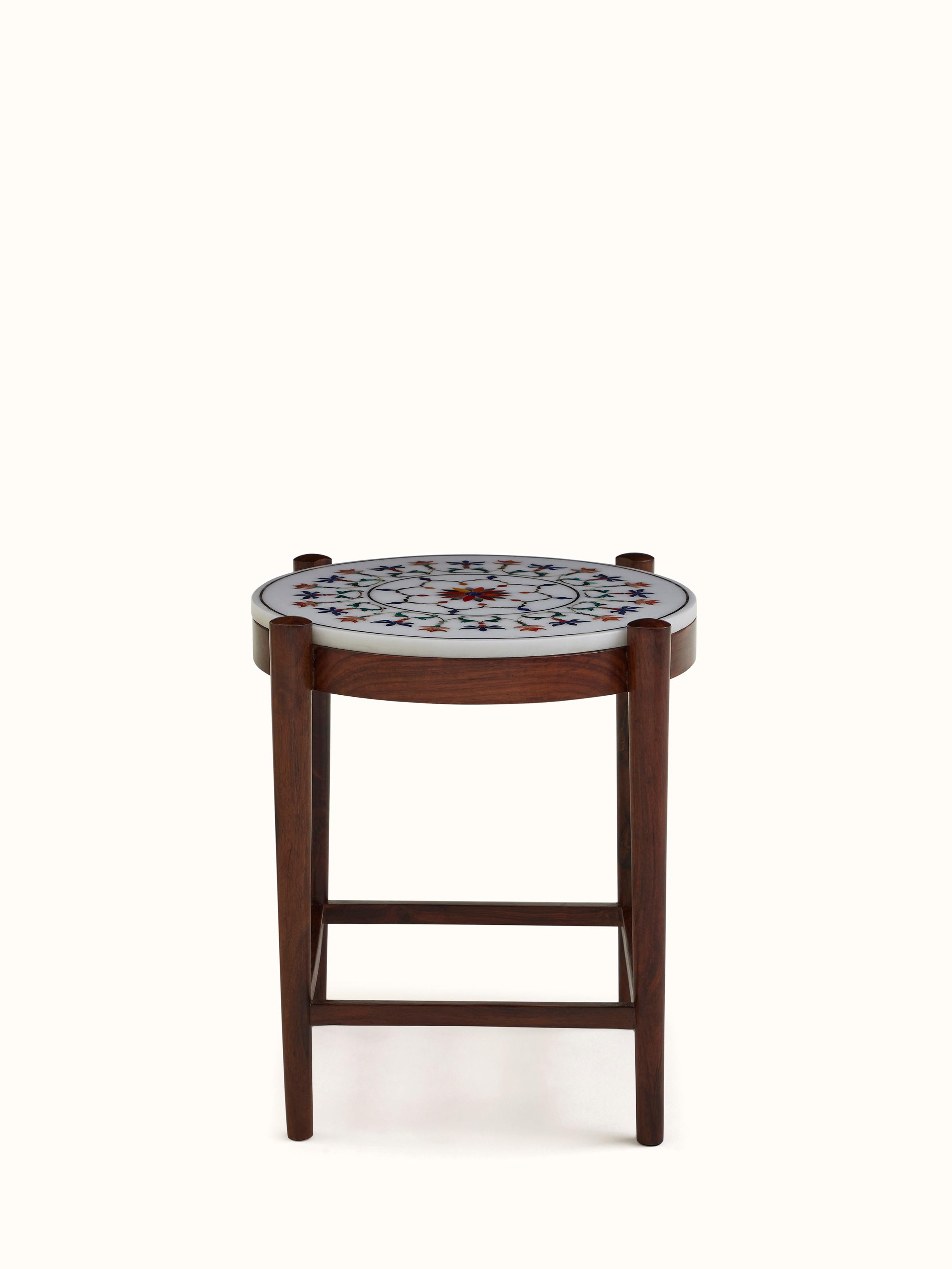 Angled view of marble inlaid sheesham wood nesting table set, emphasizing the layered design and marble accents