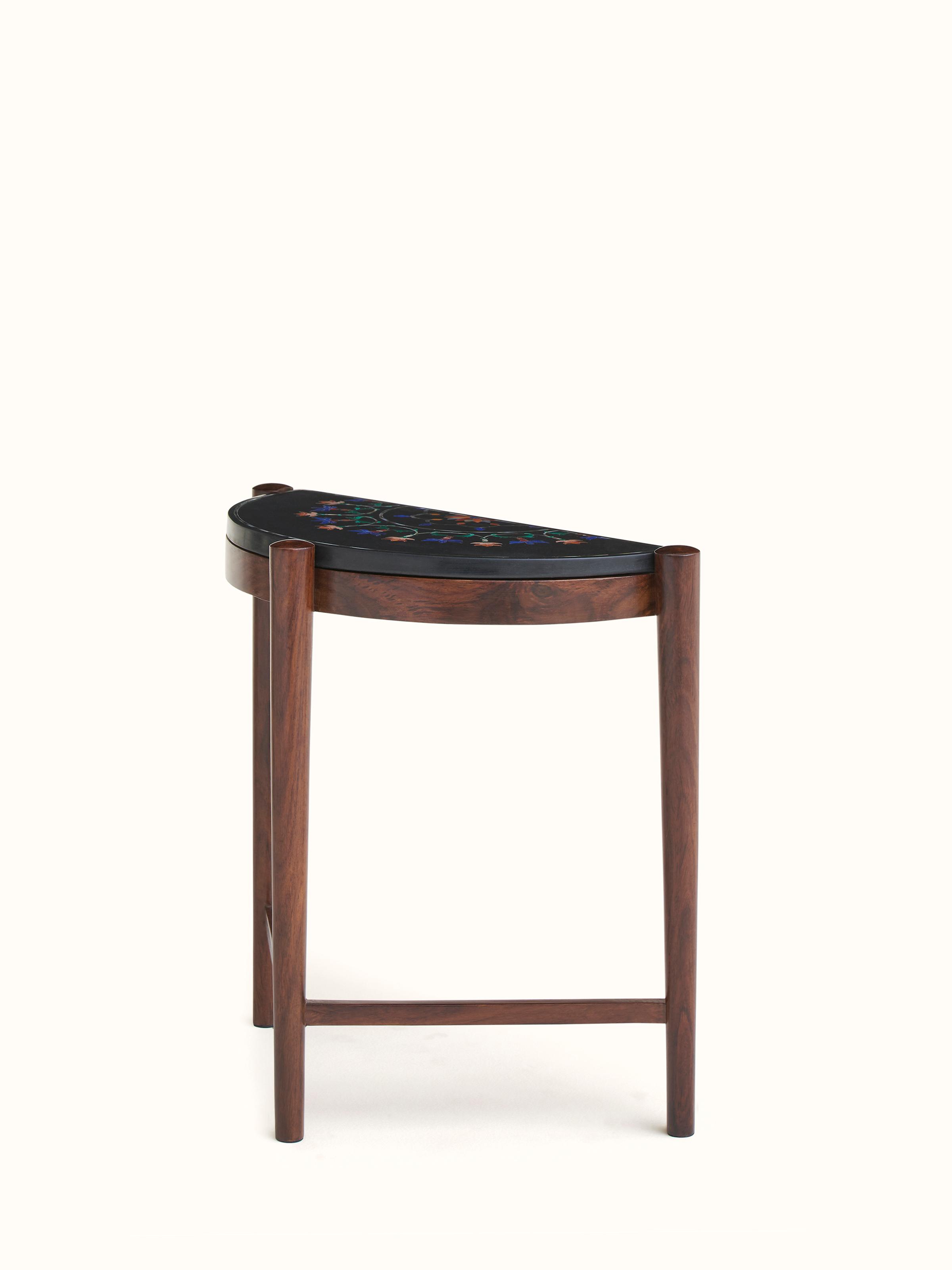 Close-up of marble inlay on sheesham wood nesting table, focusing on the detailed marble craftsmanship and wood texture