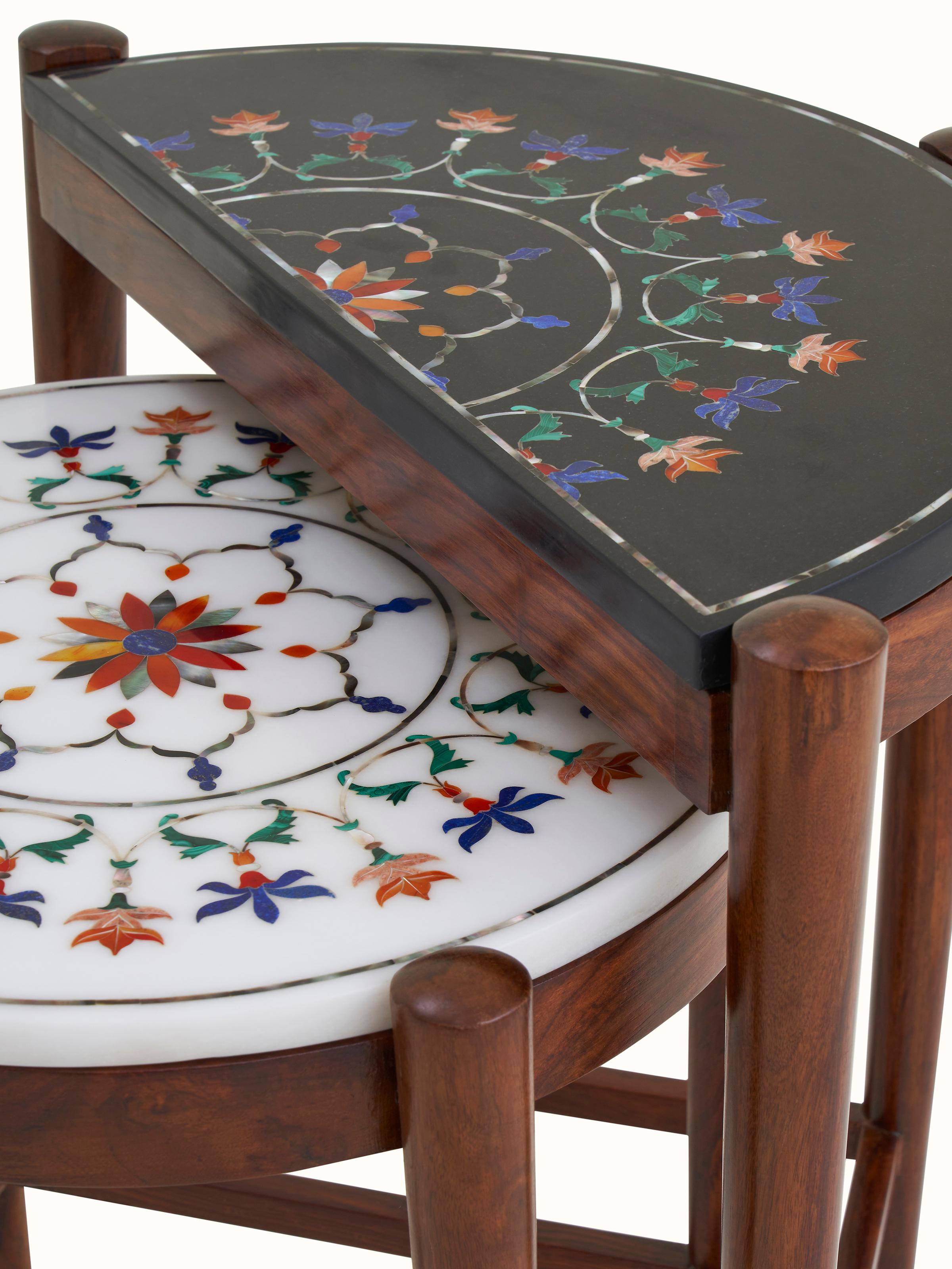 Detail view of marble inlaid sheesham wood nesting table, showing the marble inlay pattern and wood finish