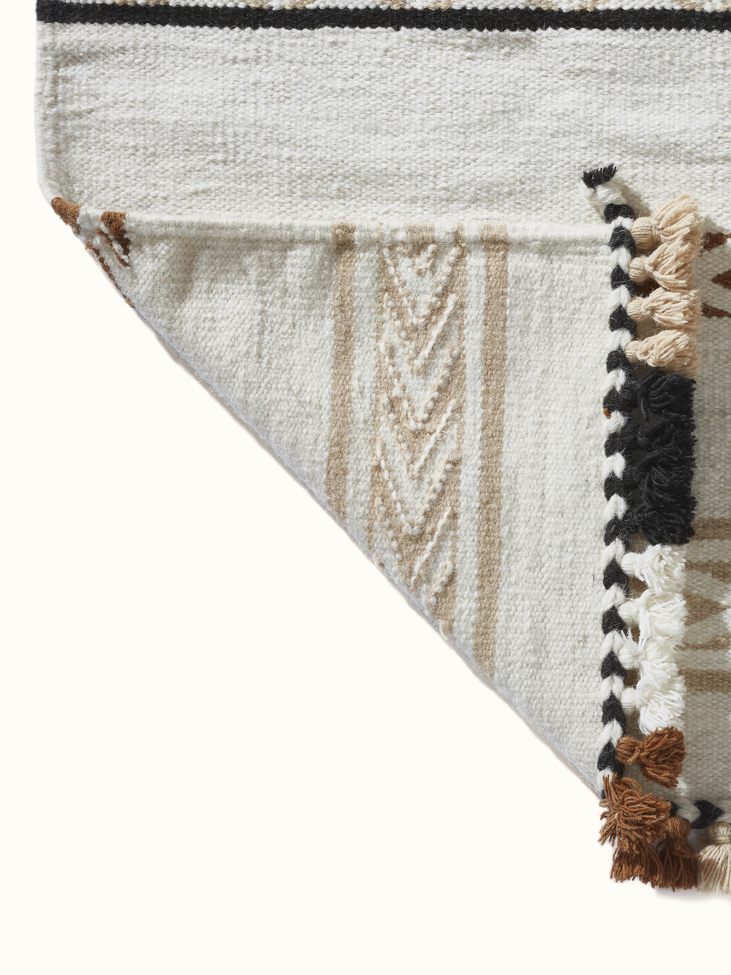 Close-up of Geo stripes ivory Gujarat wool & cotton panja dhurrie kharad, focusing on the intricate weaving and stripe pattern