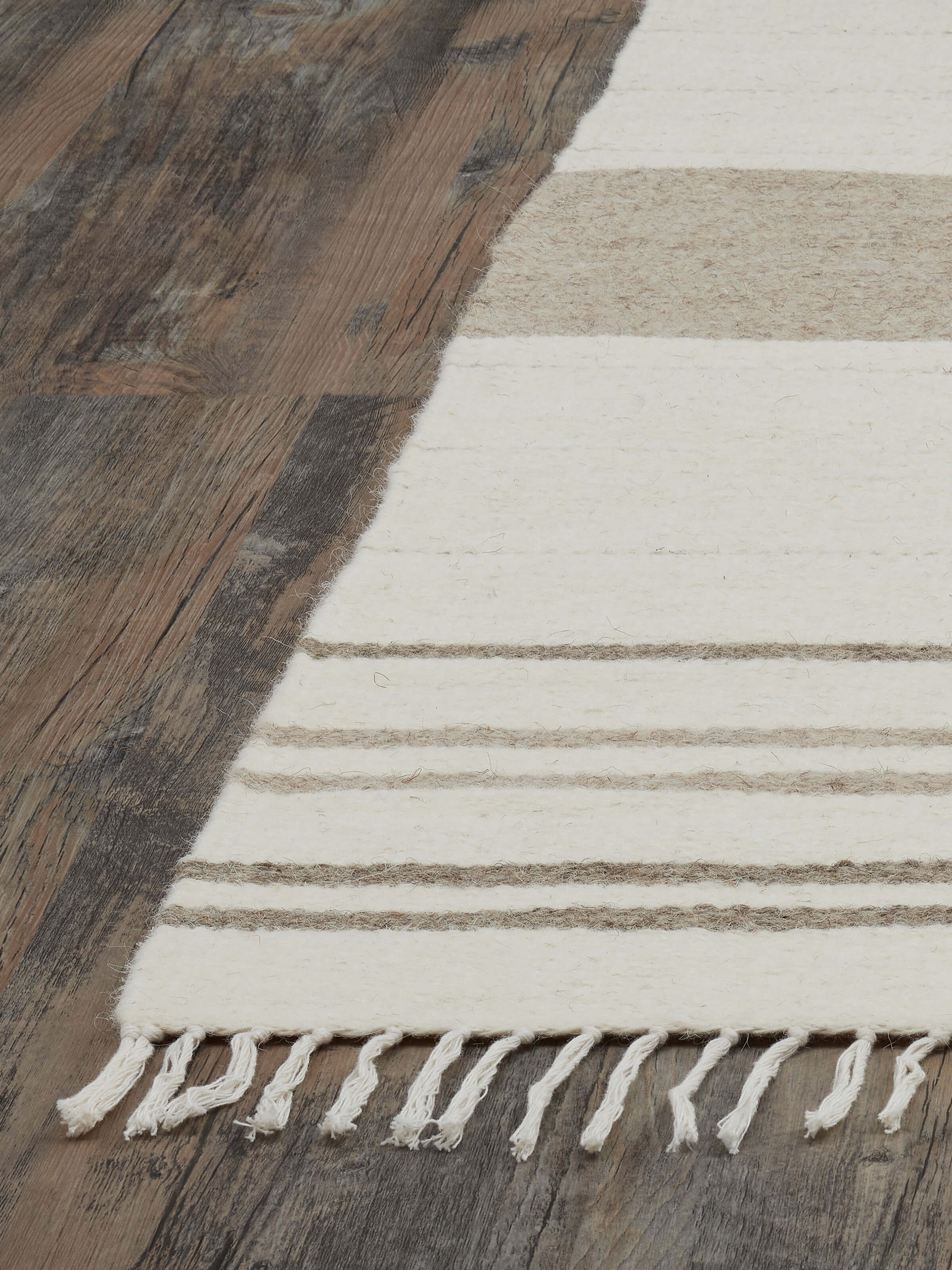 Detailed view of Nomad Stripes Ivory Beige Jawaja wool & cotton handloom dhurrie focusing on the striped pattern and fabric texture.