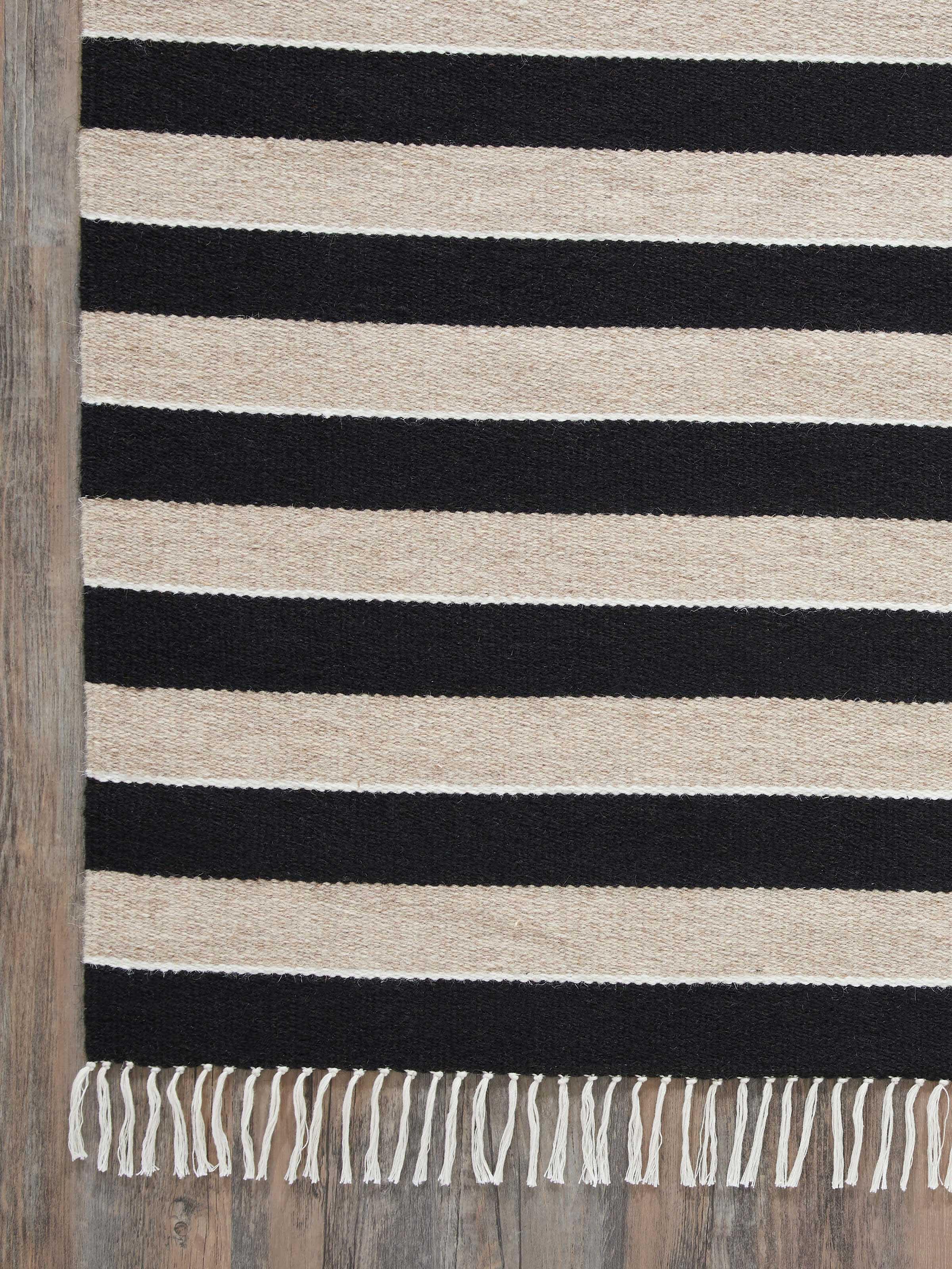 Detailed view of Nomad Stripes Black Beige Jawaja Wool & Cotton Handloom Dhurrie (4x6 ft) emphasizing texture