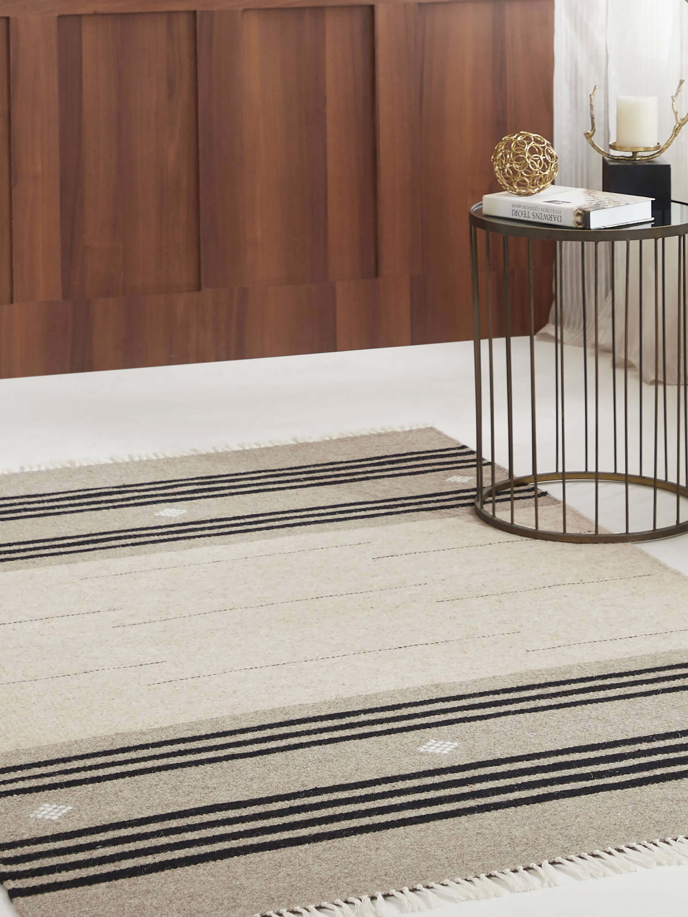 Nomad beige black striped Jawaja wool dhurrie placed in rustic-modern room (4x6 ft)