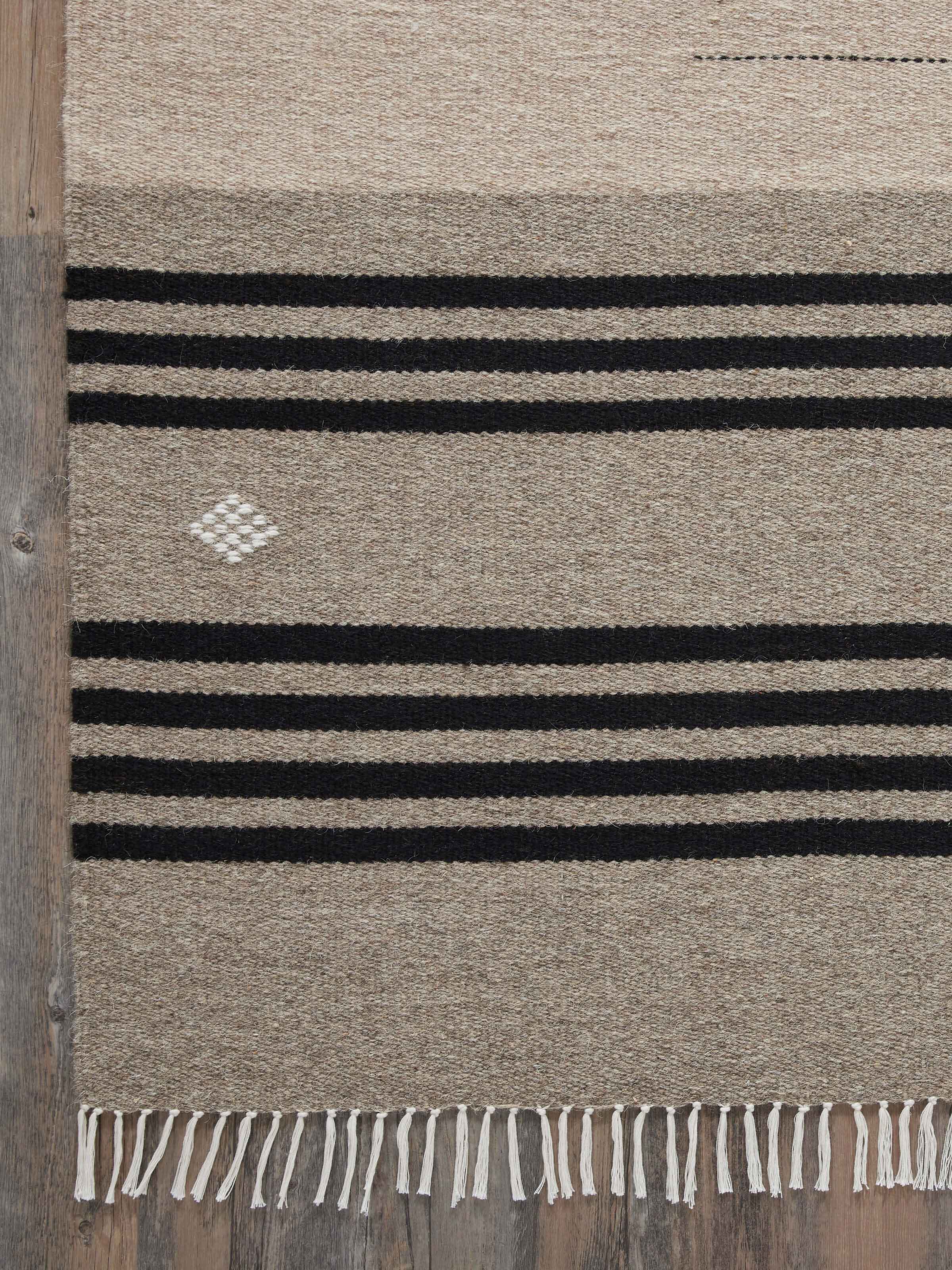 Nomad stripes beige black Jawaja wool & cotton handloom dhurrie (4x6 ft) spread out to highlight the design and texture.