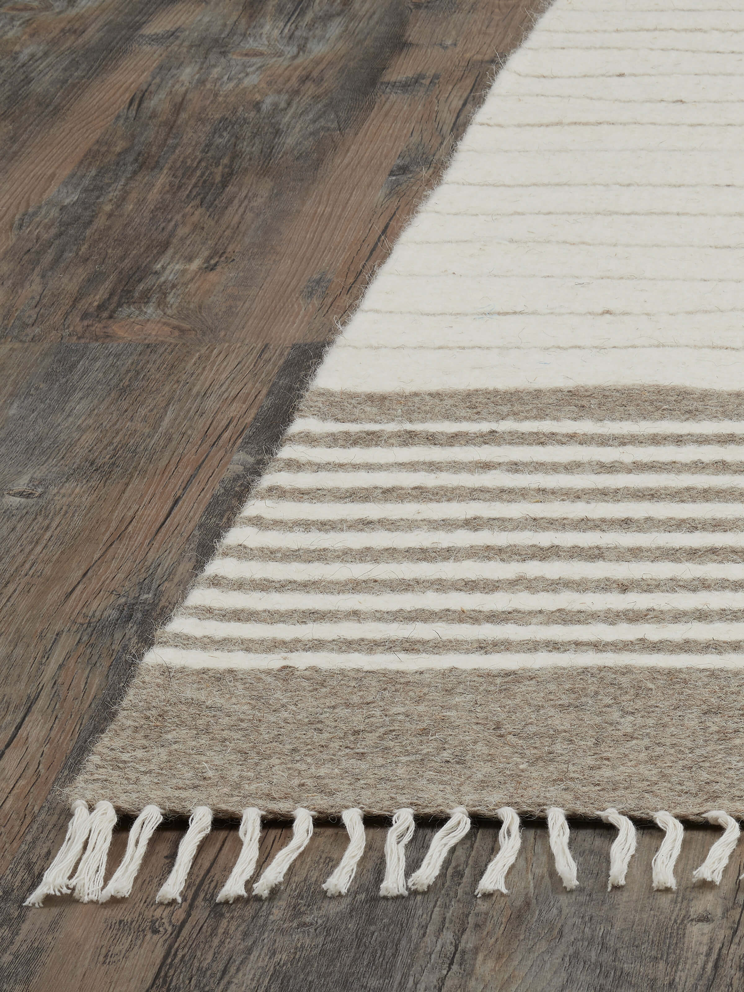 Detailed image showcasing the stripes on the Nomad beige ivory Jawaja wool and cotton dhurrie