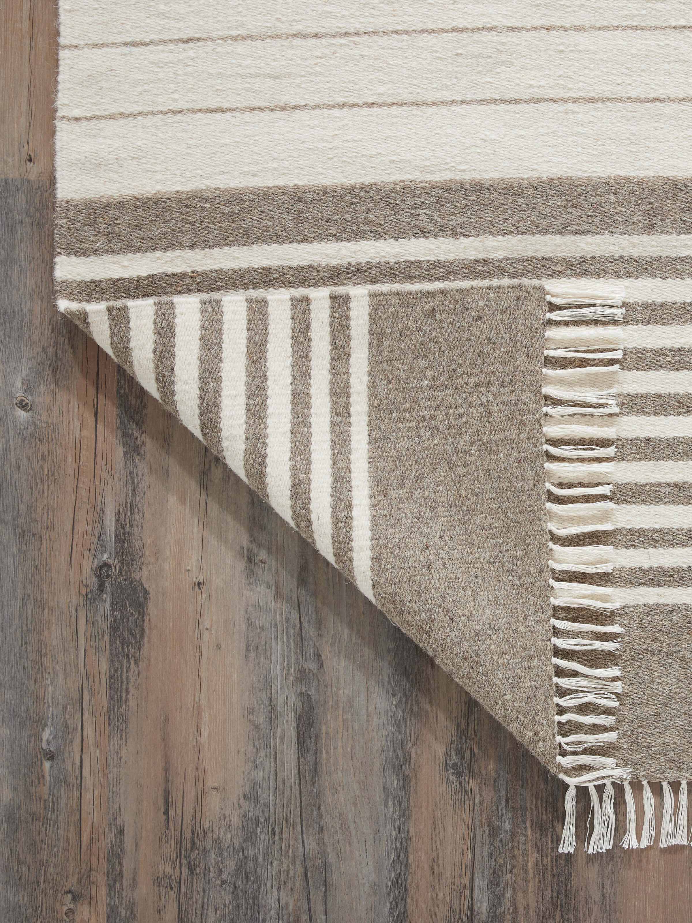 Close-up of the Nomad stripes dhurrie emphasizing the weaving detail and color