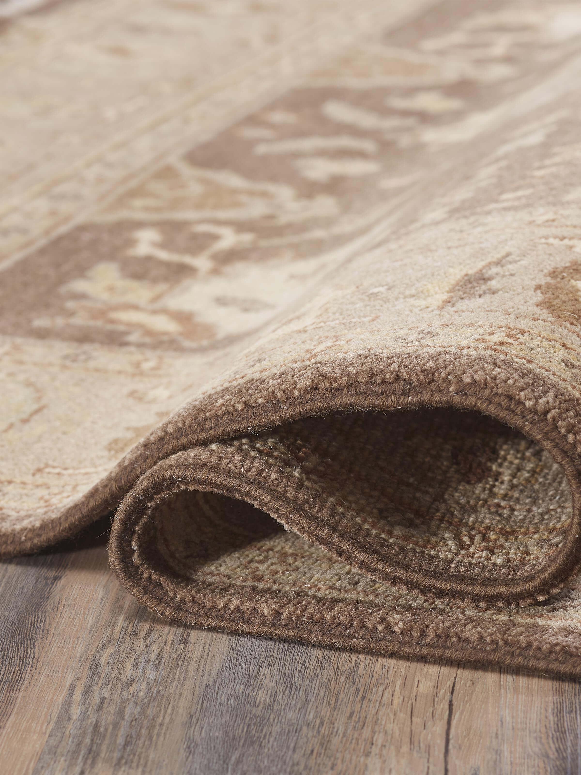 Detailed view of Oushak traditional brown Jaipur wool hand-knotted rug, highlighting the intricate knotting and traditional design.