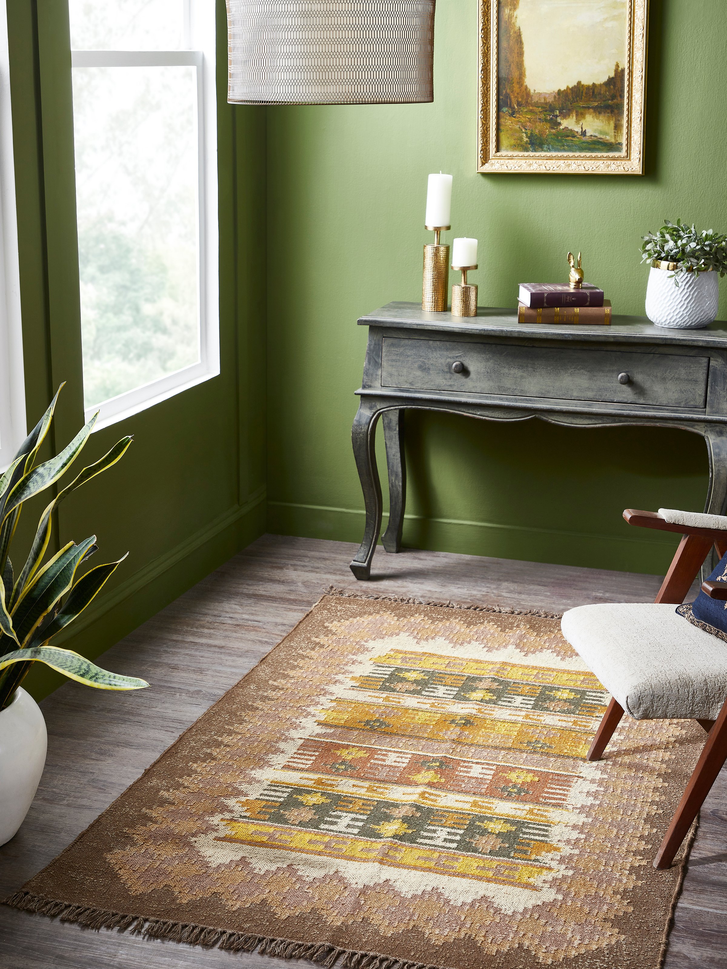 Long shot of brown Lawan jute Panja dhurrie showcasing traditional kilim patterns on floor setting