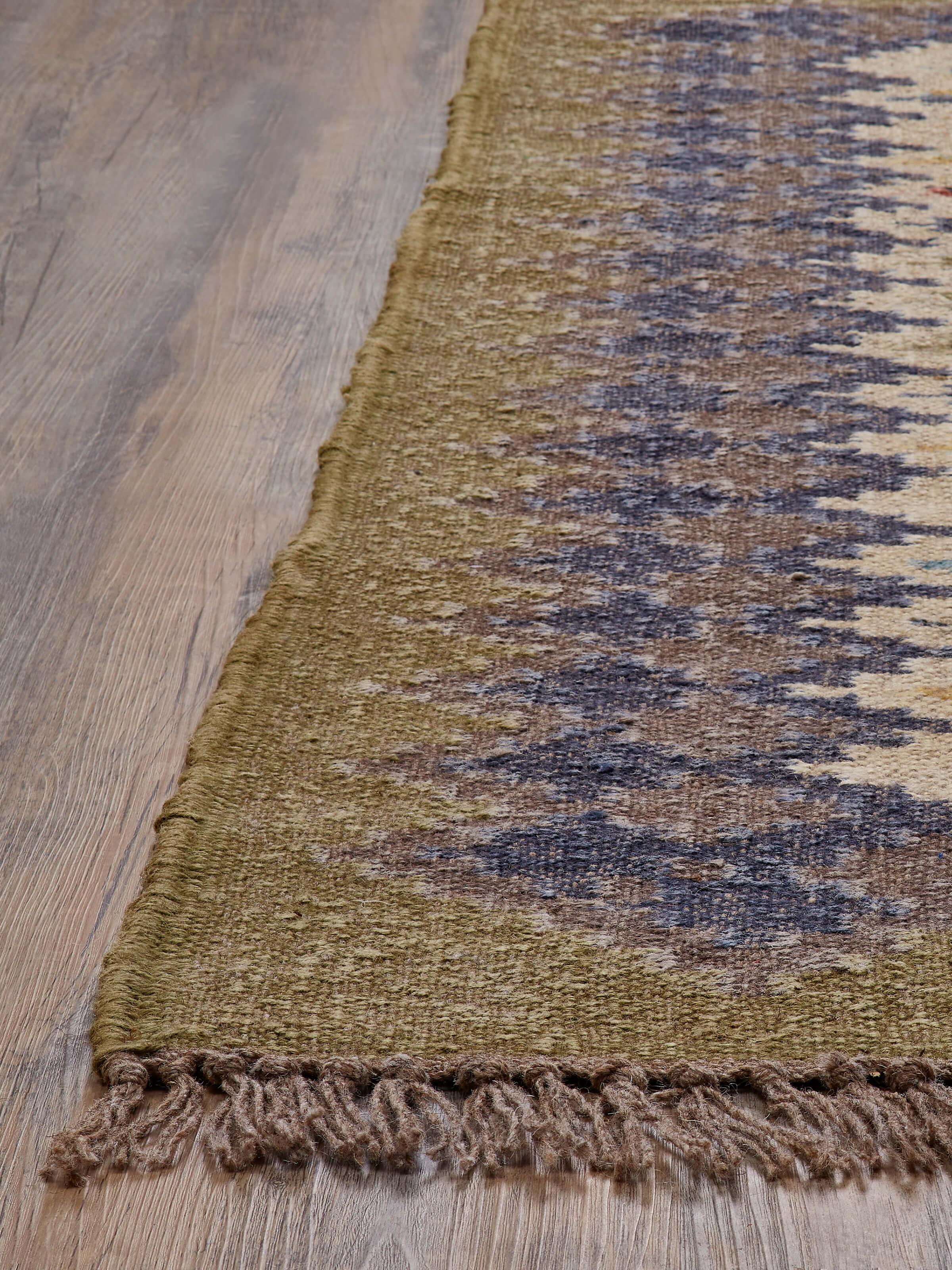 Close-up view of Traditional Kilim green blue lawan jute & wool panja dhurrie, highlighting the detailed weaving and design.