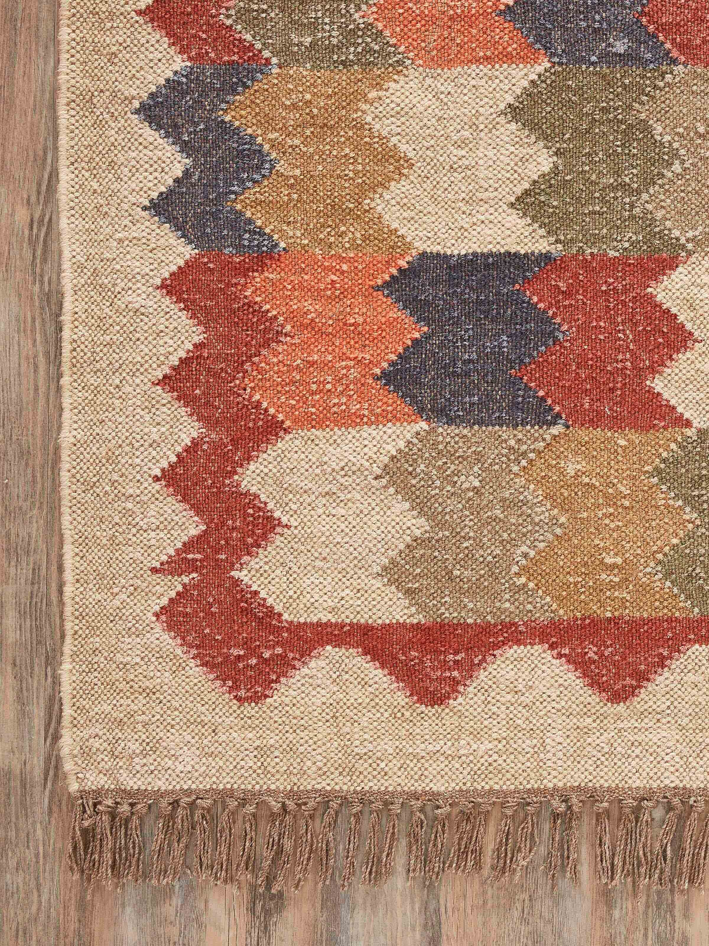 Side view of Geo Chevrons Jute & Wool Panja Dhurrie, emphasizing the thickness and weave of the jute-wool material.