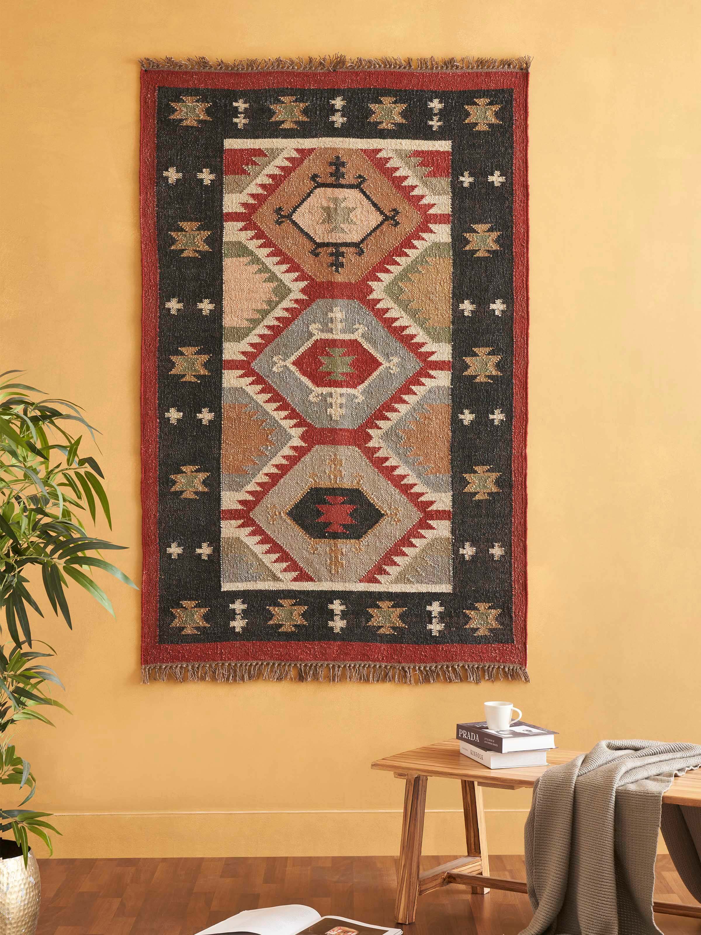 Close-up of Traditional Kilim Black Lawan jute & wool panja dhurrie, highlighting the intricate black pattern and fabric texture.