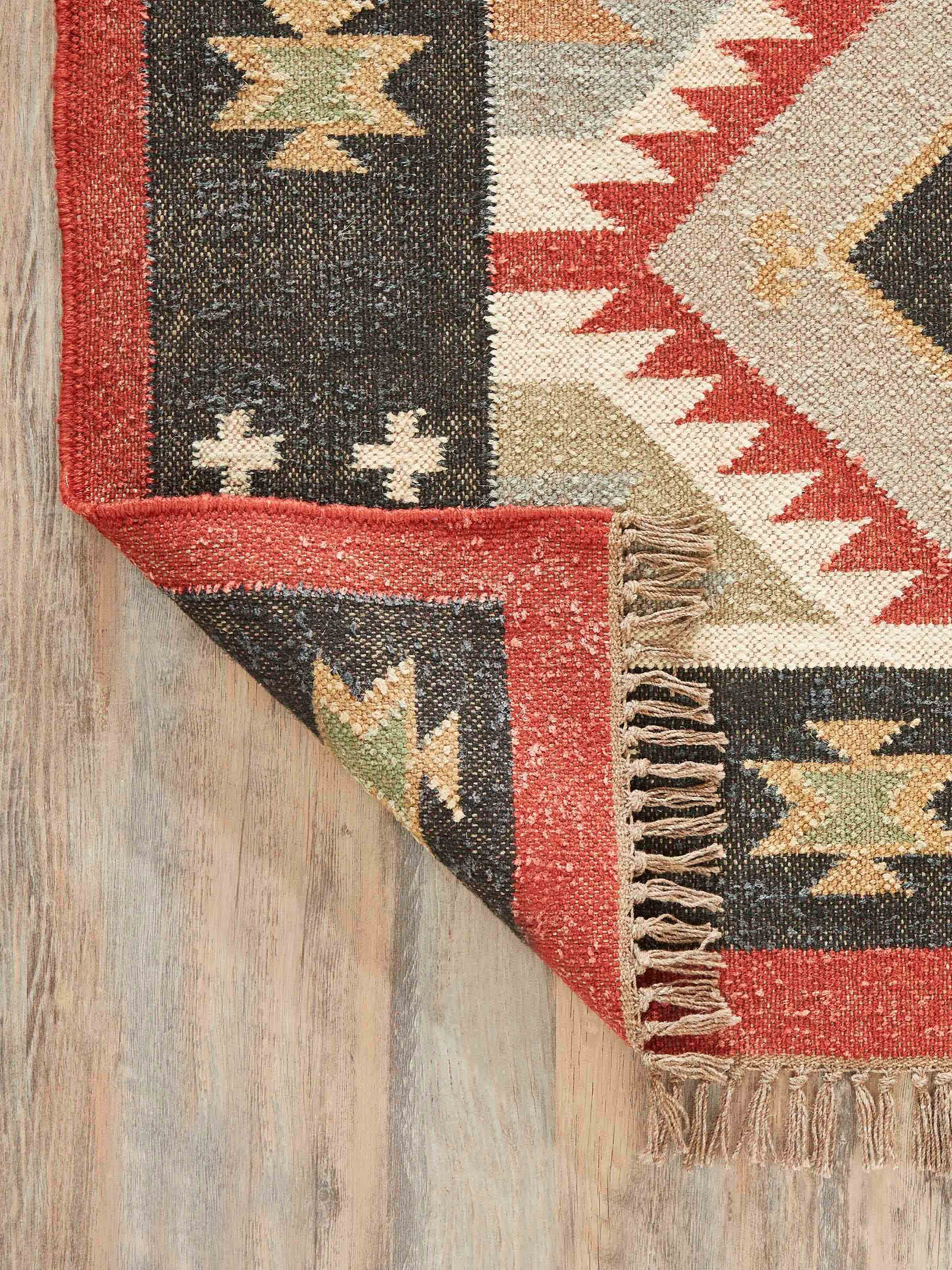 Close-up of Traditional Kilim Black Lawan jute & wool panja dhurrie, focusing on the jute and wool texture and black kilim design.