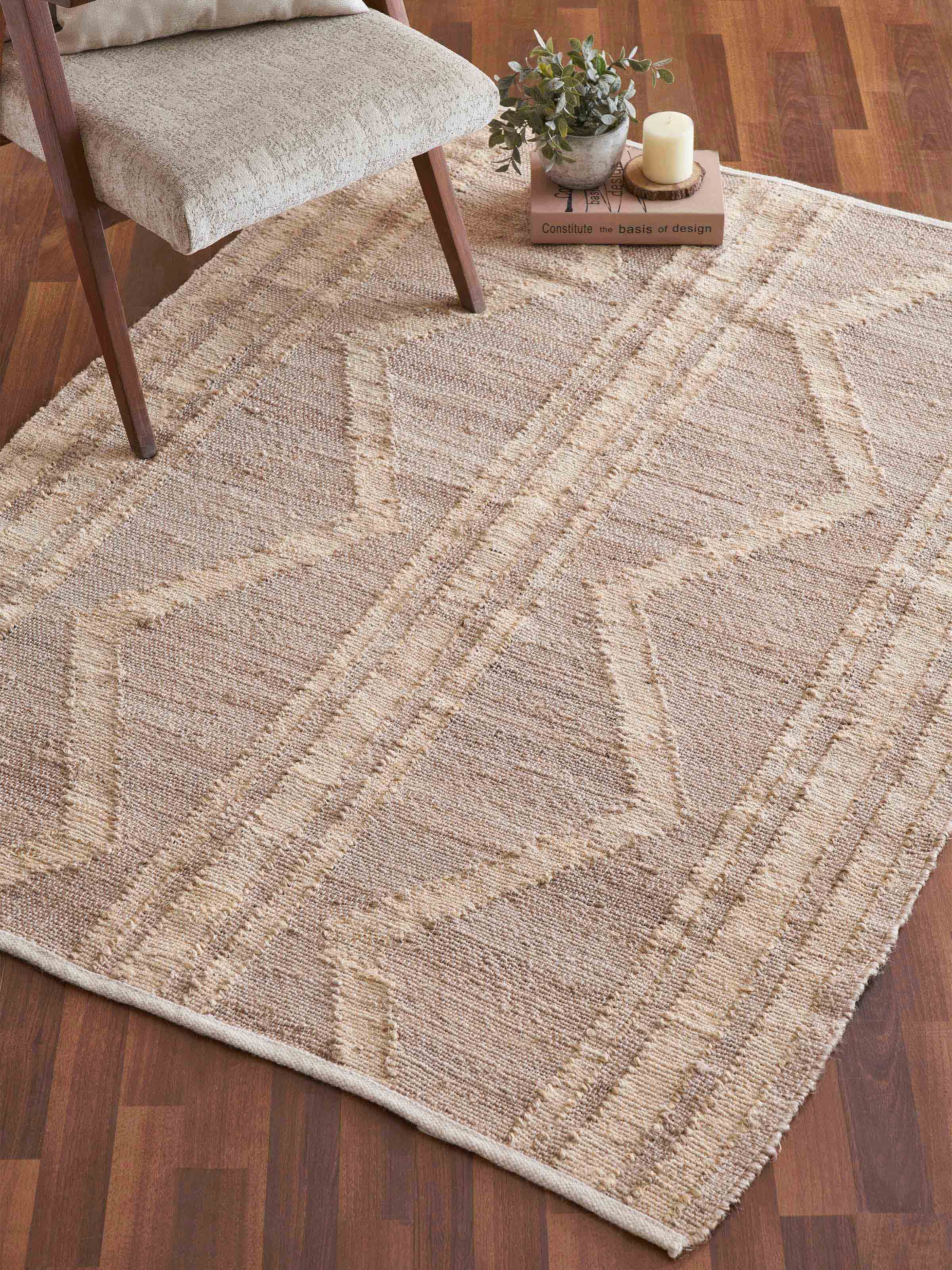 Close-up of Contemporary geo beige jute & cotton natural fibre rug (5x8 ft) showcasing its geometric pattern and texture.