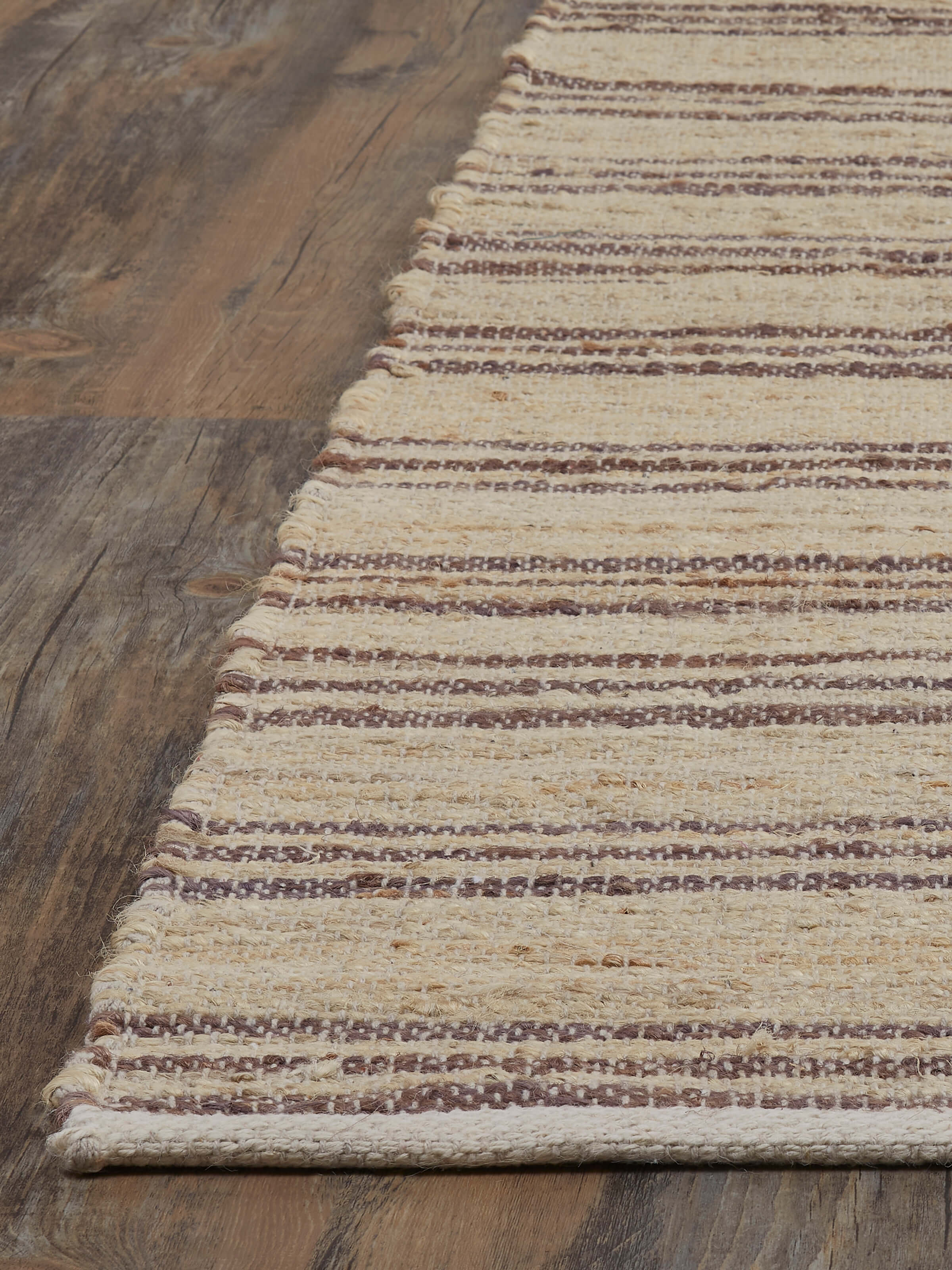 Detailed view of the stripes on Geo Stripes beige brown jute & cotton natural fibre rug