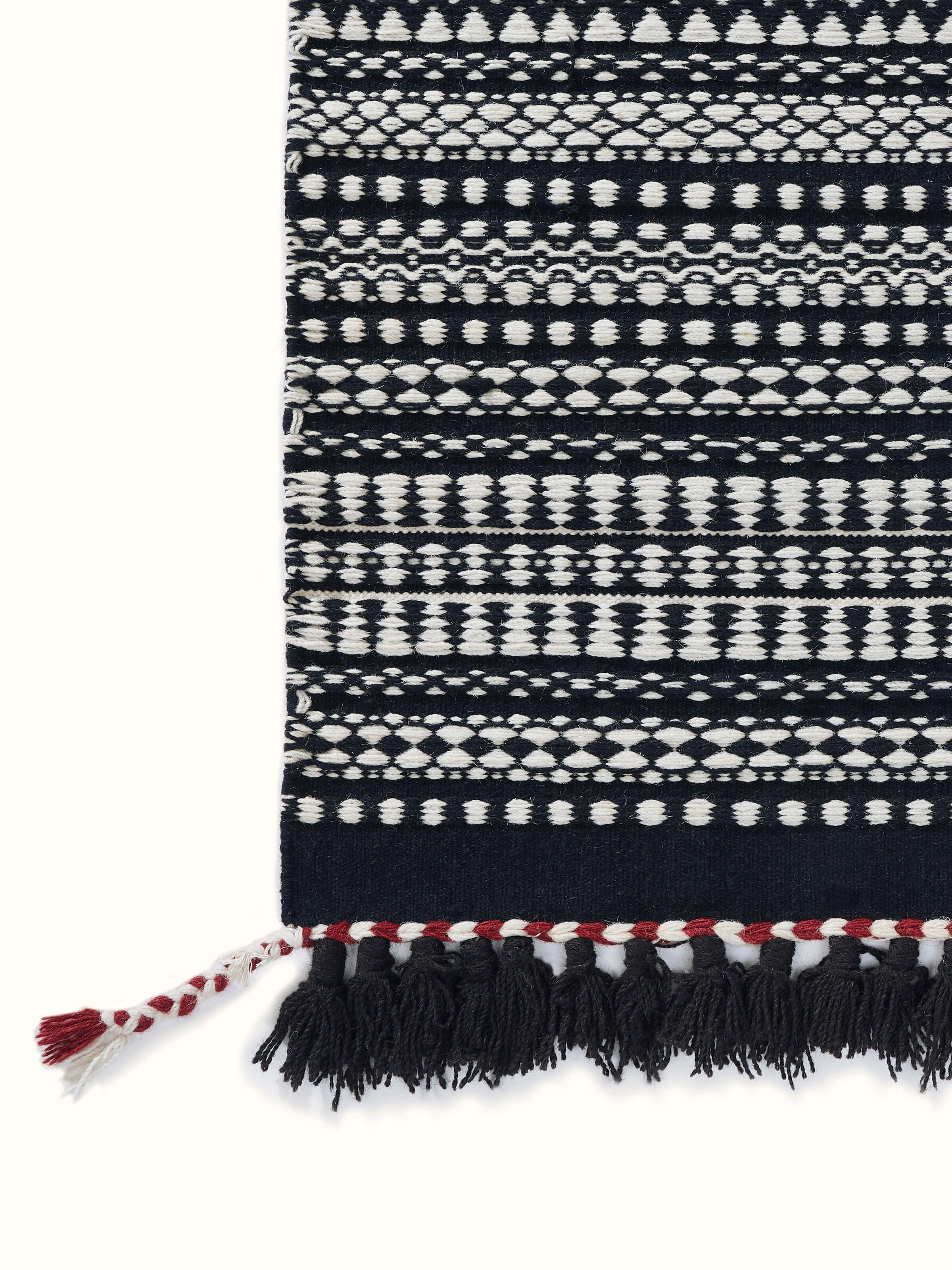 Top view of Sindhi textured ivory black salawas wool panja dhurrie, showing the complete pattern and overall design.