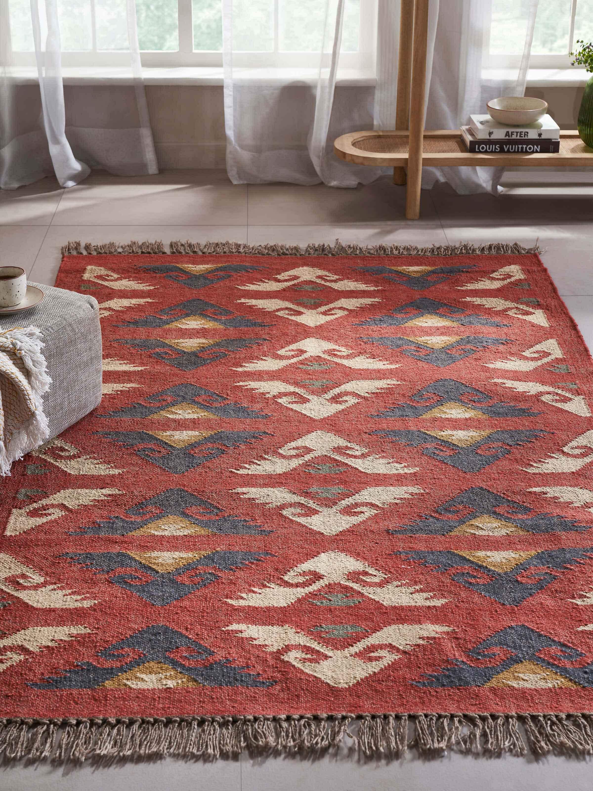 Side view of Traditional kilim red lawan wool & jute panja dhurrie highlighting its texture and design
