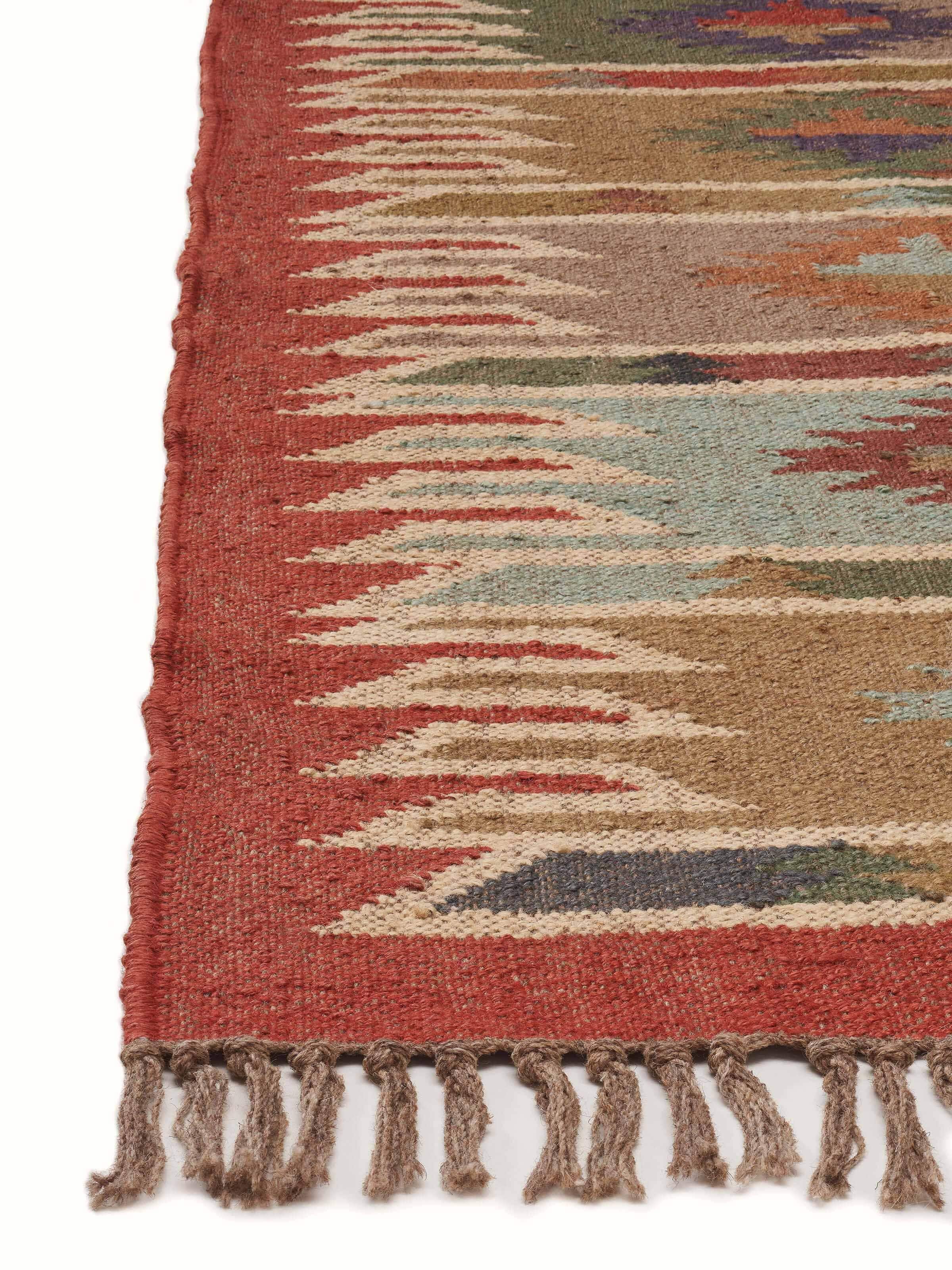 Detailed view of Traditional kilim rust green lawan jute & wool panja dhurrie showcasing its texture and traditional design.