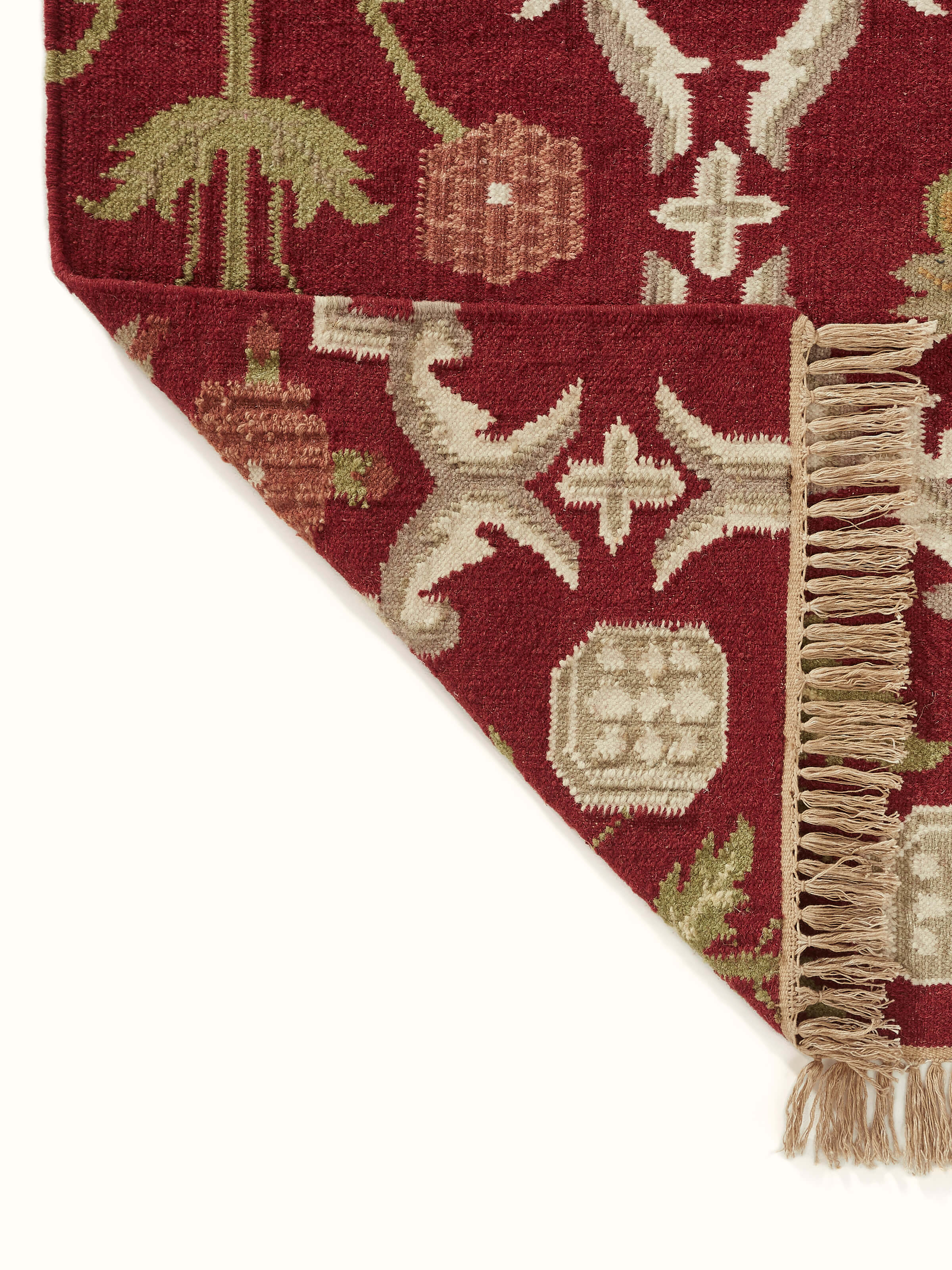 Detailed close-up of Traditional Mughal Floral Kilim Rust Salawas wool & cotton panja dhurrie focusing on the intricate design and fabric quality.