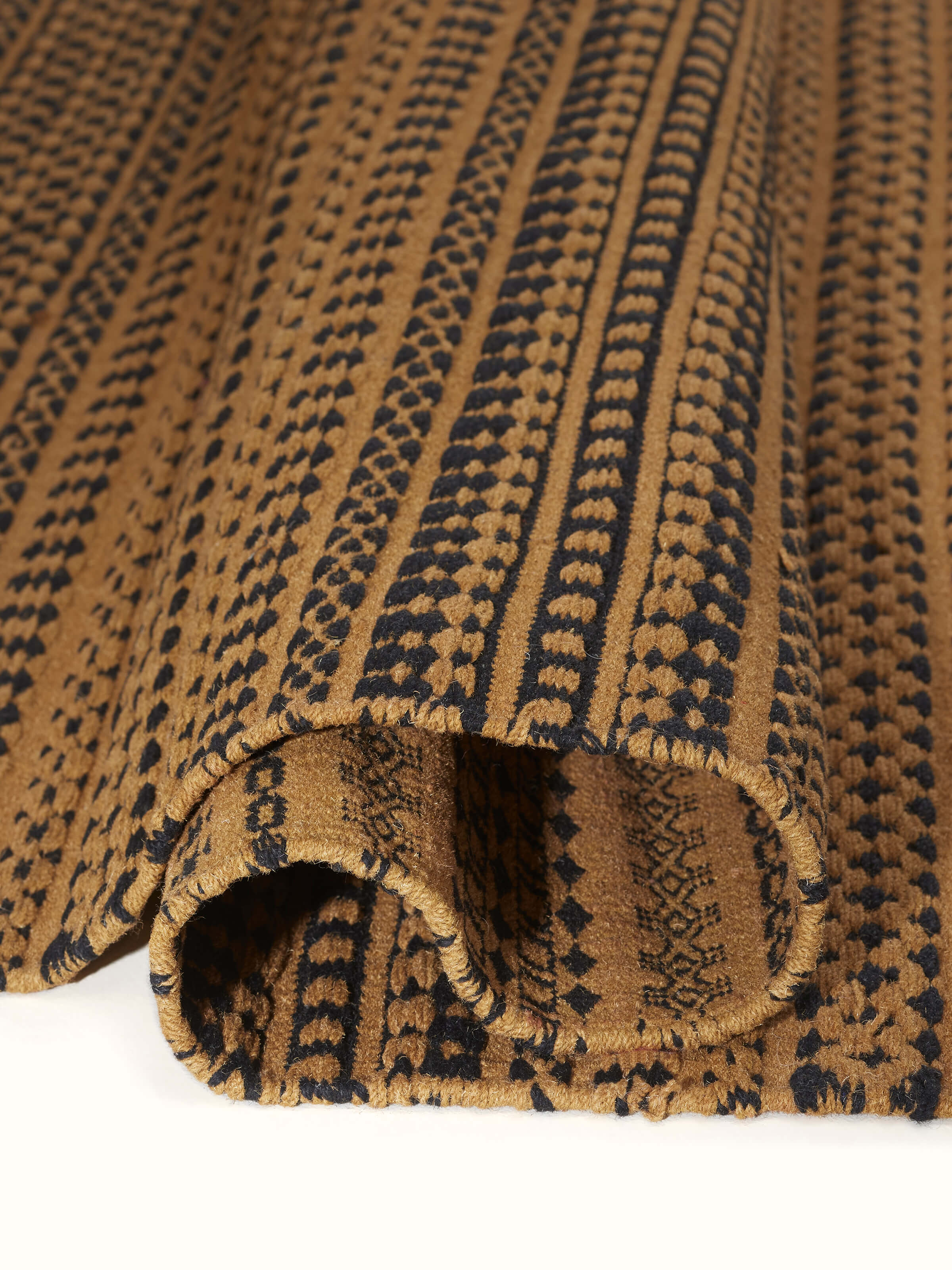 Detailed view of Sindhi textured orange salawas wool & cotton panja dhurrie, highlighting the traditional design and color depth.