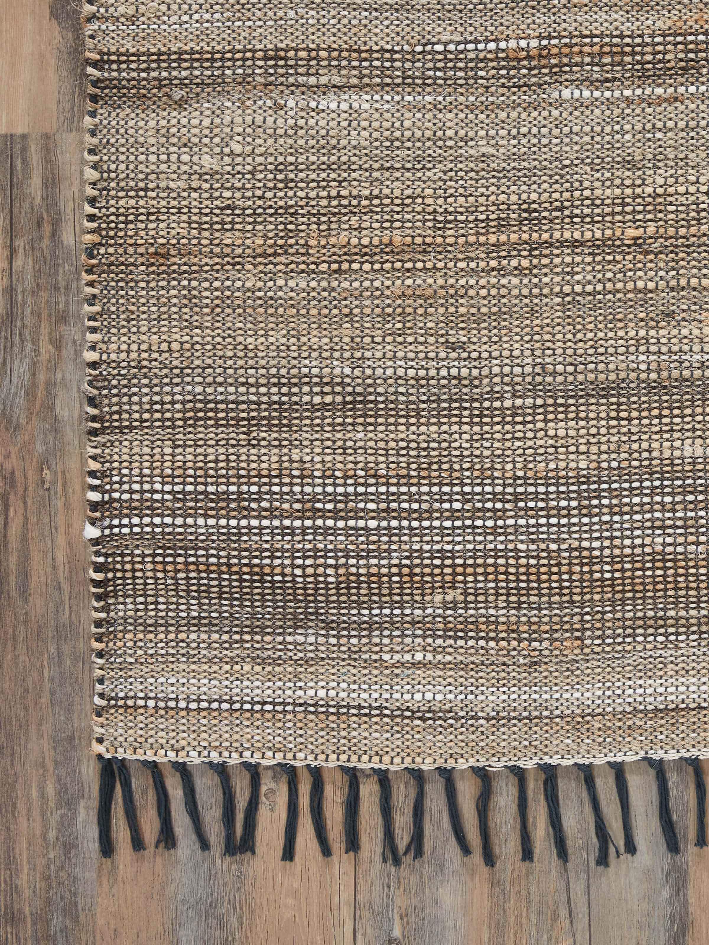 Side view of Textured Beige Charcoal Lawan Jute & Cotton Natural Fibre Rug, showing the depth and texture of the fibers.