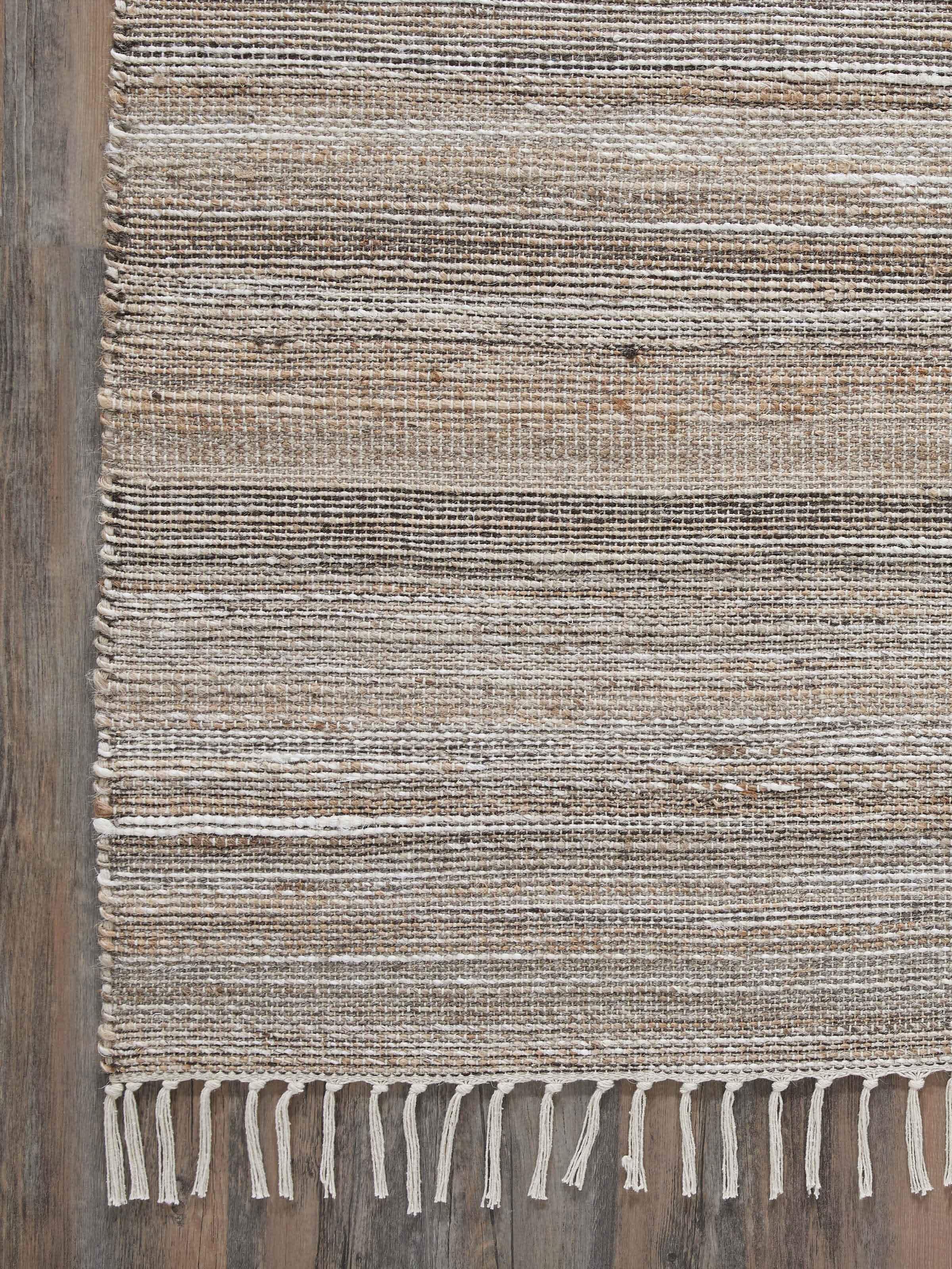 Detailed shot of the textured surface of Textured Beige Black Lawan Jute & Cotton Rug, emphasizing the natural weave.