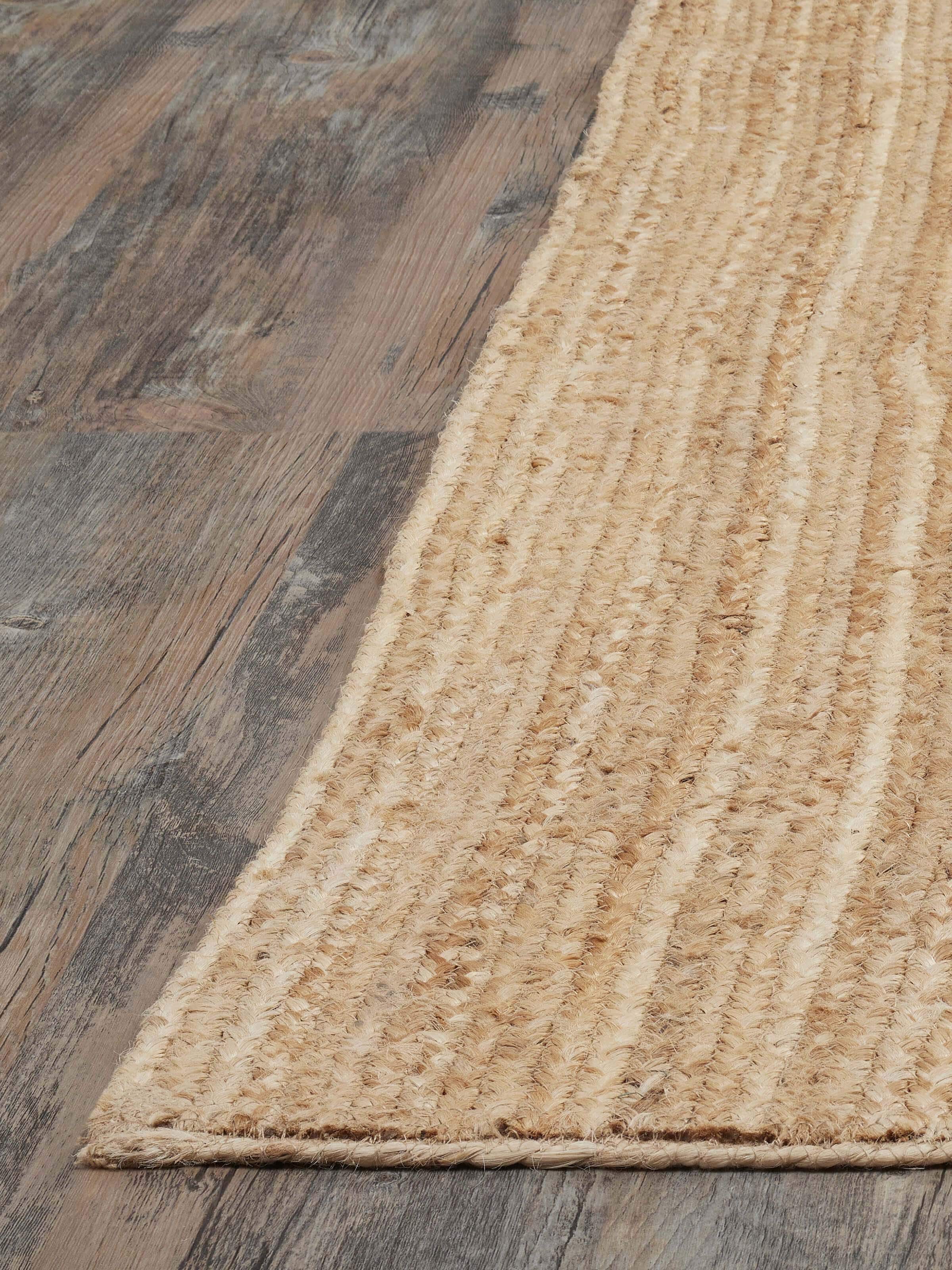 Close-up of the braided stripe beige Lawan jute natural fibre rug, highlighting the detailed texture.