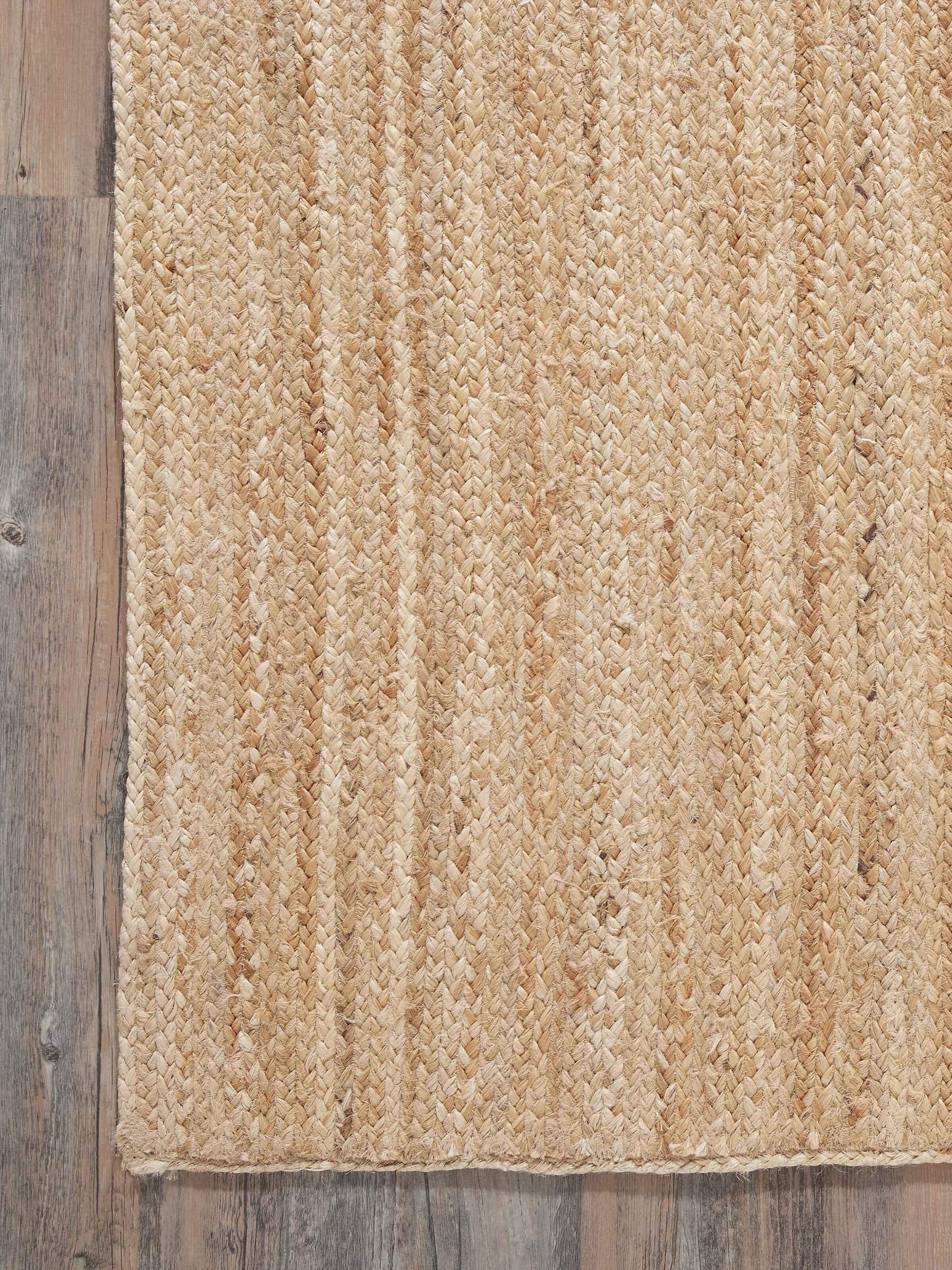 Detailed view of the braided stripe beige Lawan jute natural fibre rug, emphasizing the texture and natural fibres.