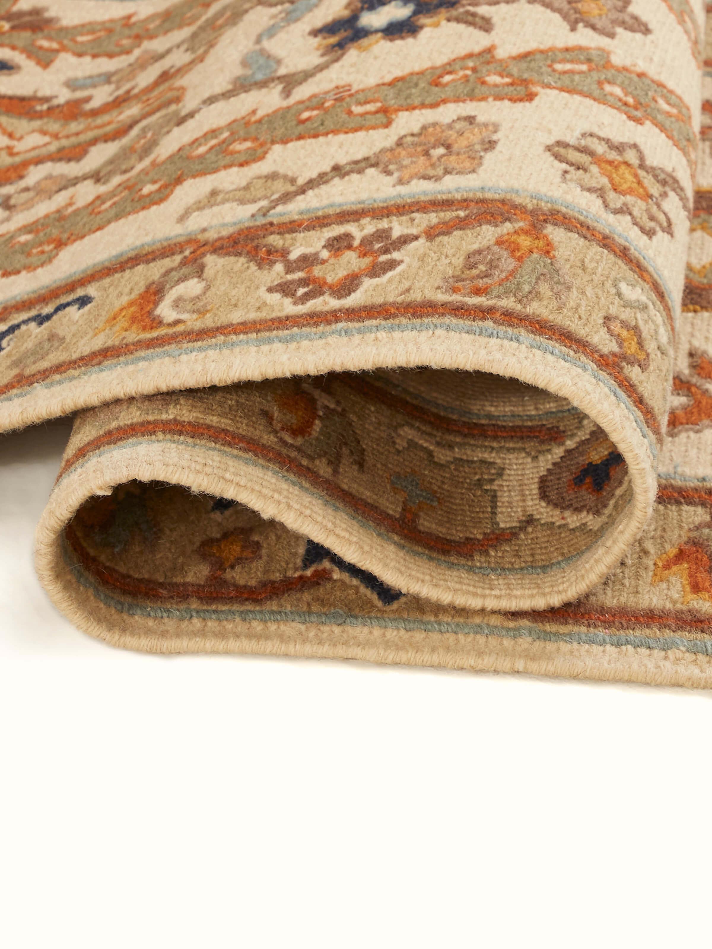 Folded view of Nomad traditional off-white Bhadohi wool hand-knotted runner displaying its design and compact form.