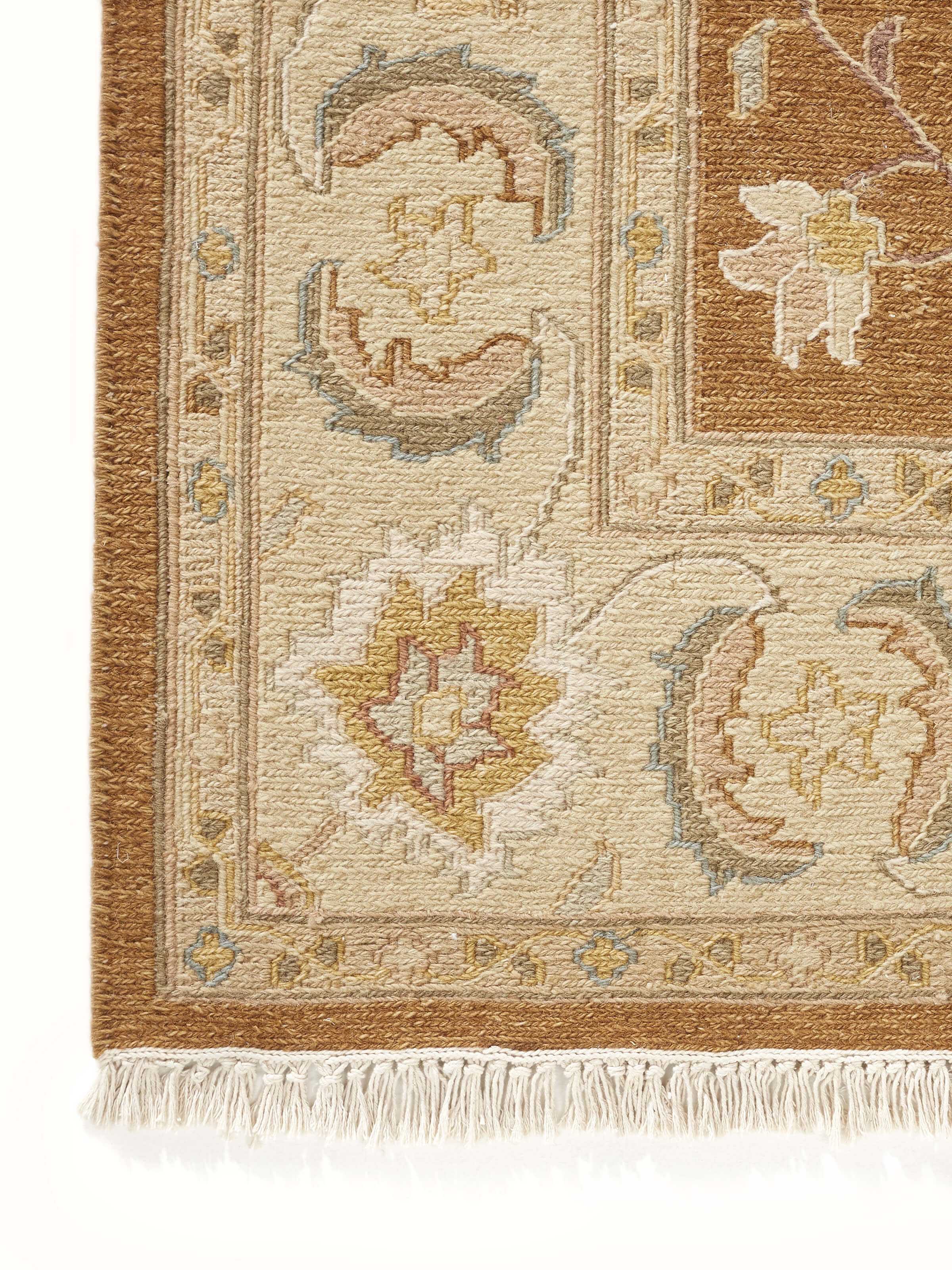 Detailed view of the Traditional Sumak brown Charbagh Bhadohi rug highlighting the craftsmanship and wool texture