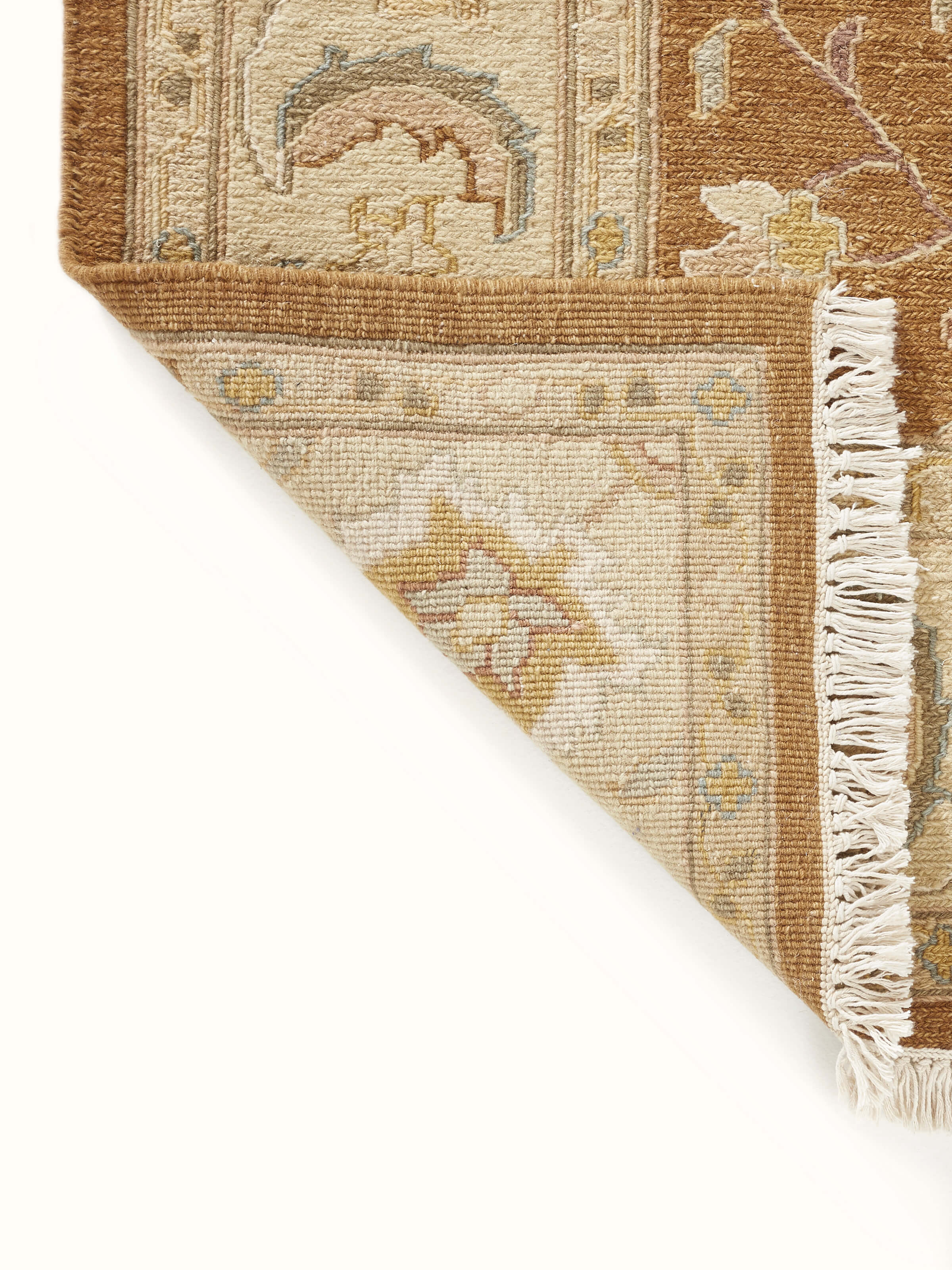 Traditional Sumak brown Charbagh Bhadohi wool hand-knotted rug styled in a room setting to show scale and style