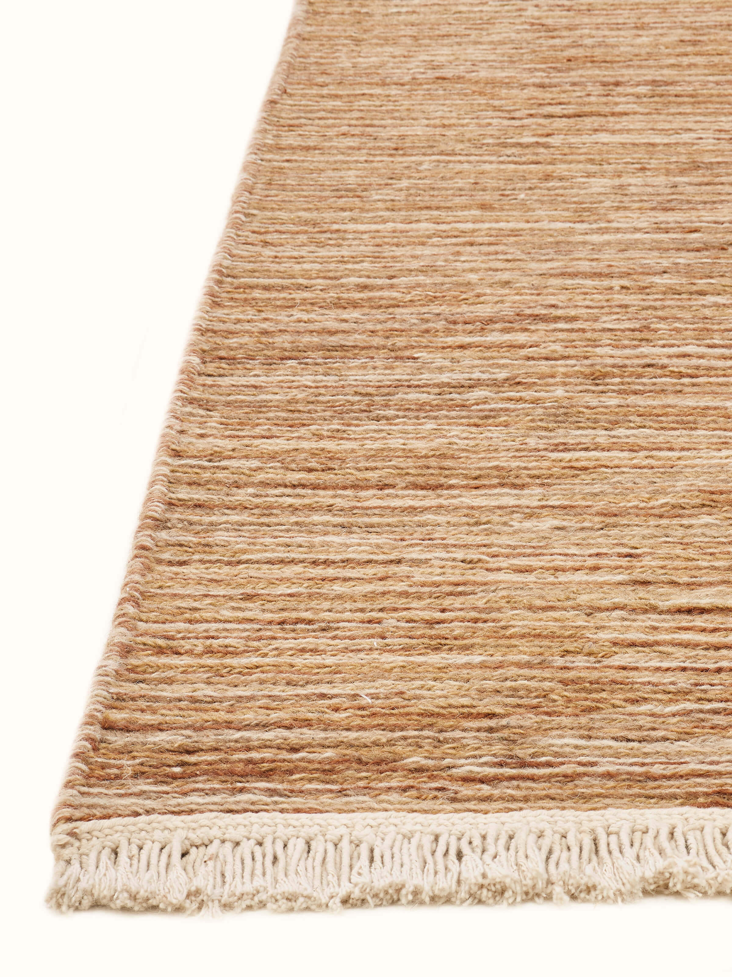 Angled view of Solid Textured Sumak Beige Rust Bhadohi Wool Hand-Knotted Rug, emphasizing its rich texture and pattern.