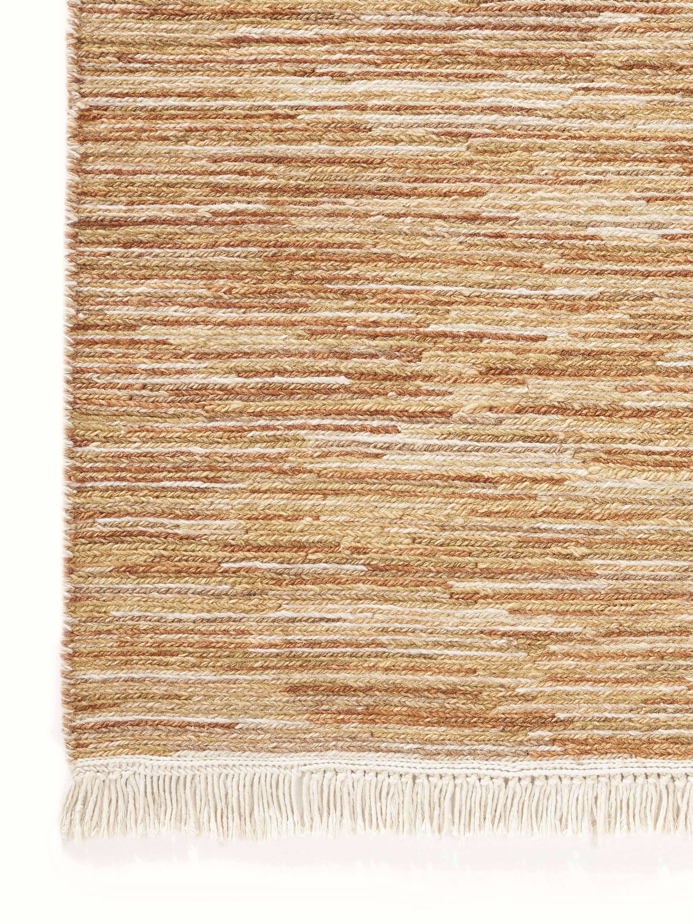 Full view of the Solid Textured Sumak Beige Rust Bhadohi Wool Hand-Knotted Rug, demonstrating its size and design in a room setting.