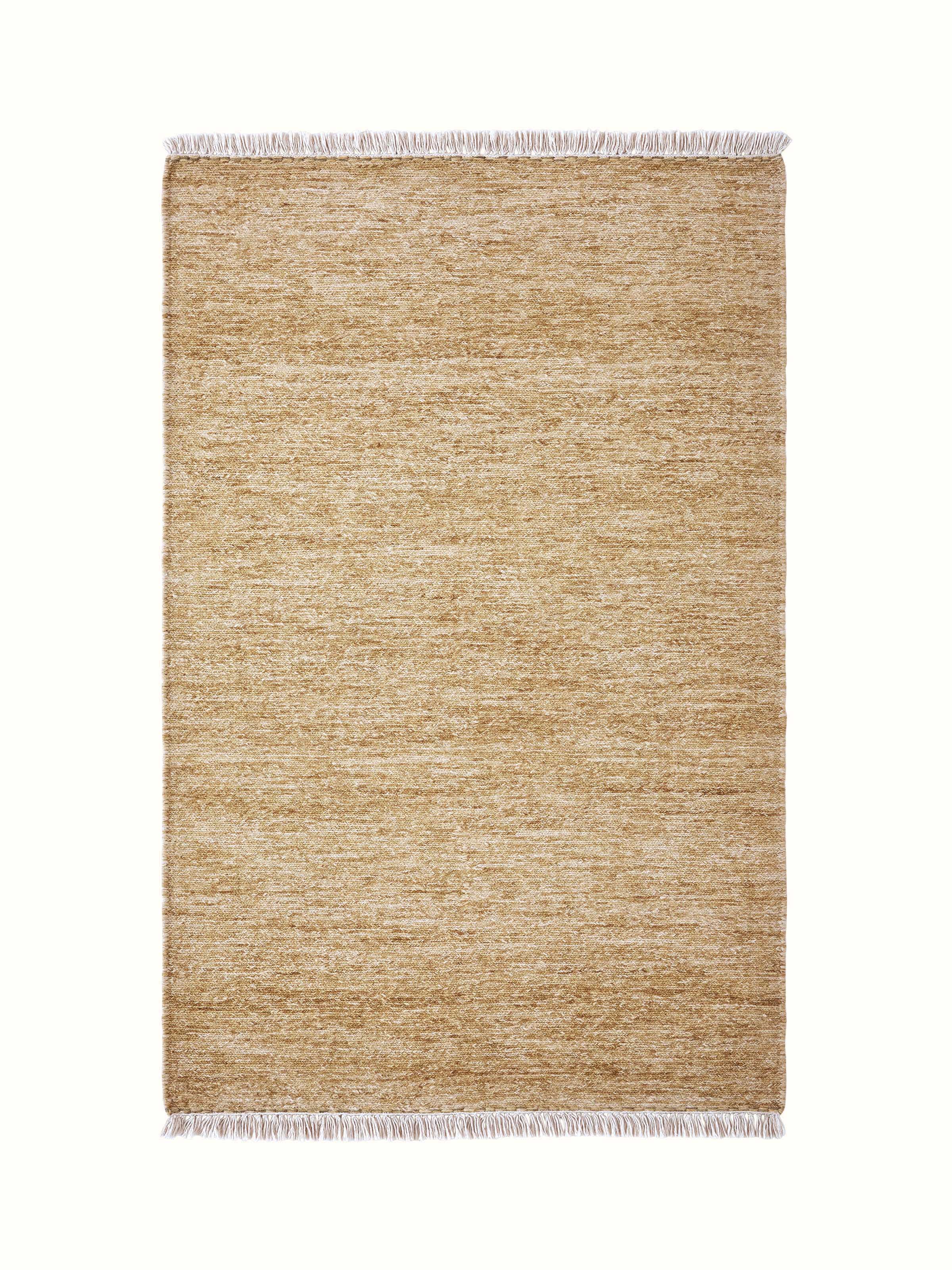 Solid textured Sumak beige Bhadohi wool hand-knotted rug, showing the rug's intricate weave and neutral color