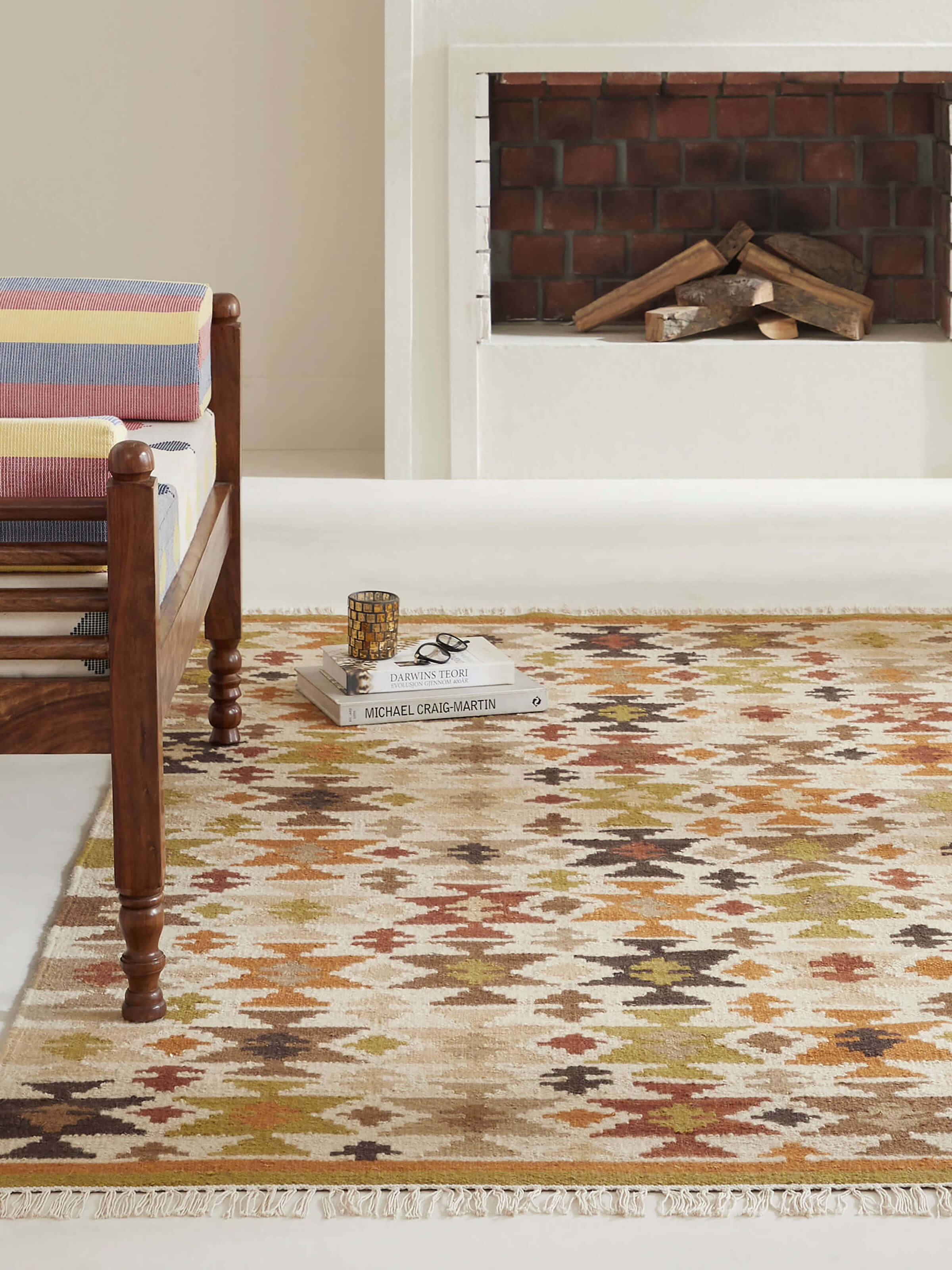 Graphic geo pattern green wool Panja dhurrie styled in a modern living room setting