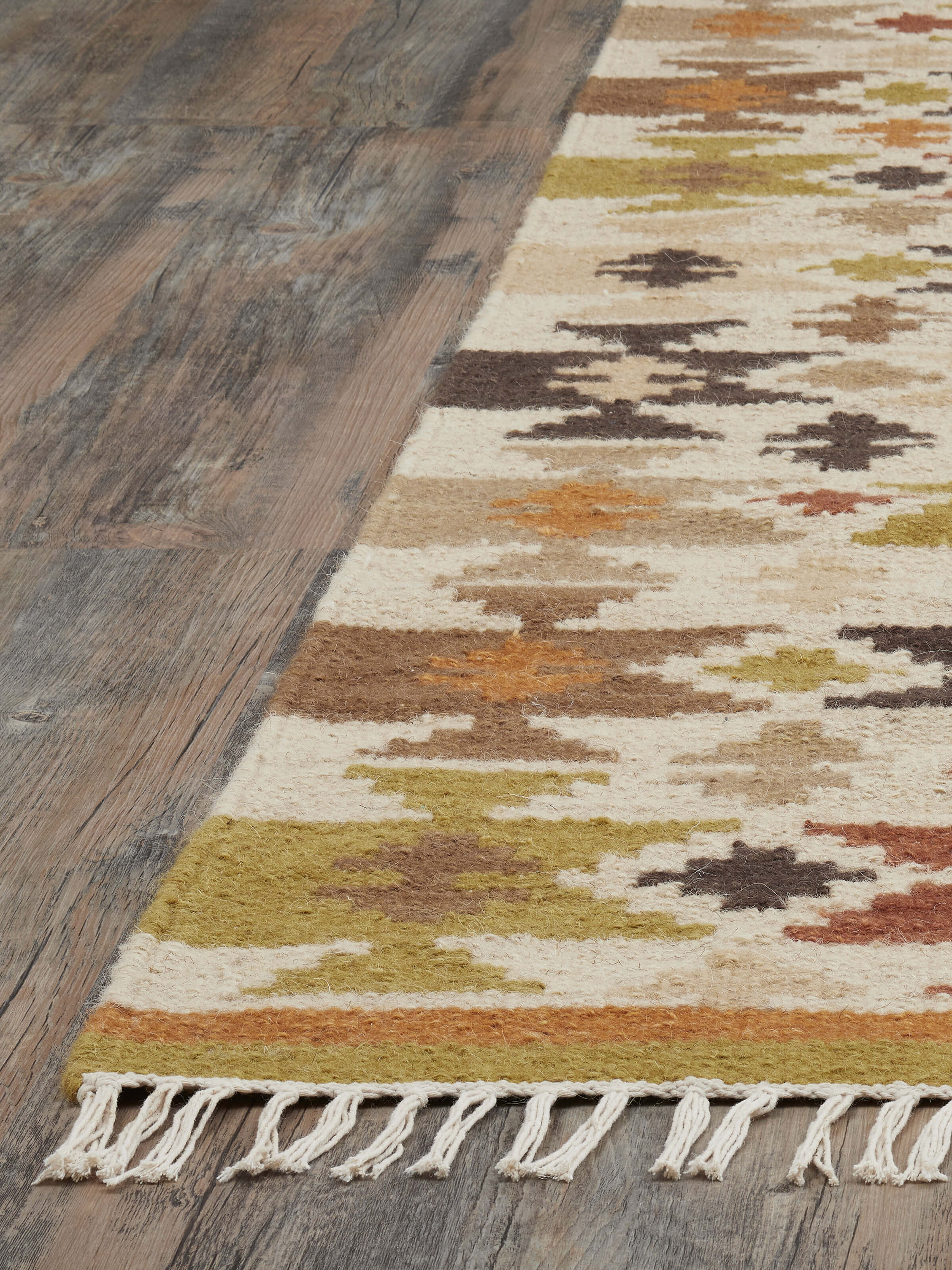 Detailed view of Graphic Geo Green Lawan wool panja dhurrie focusing on the texture and geometric design.