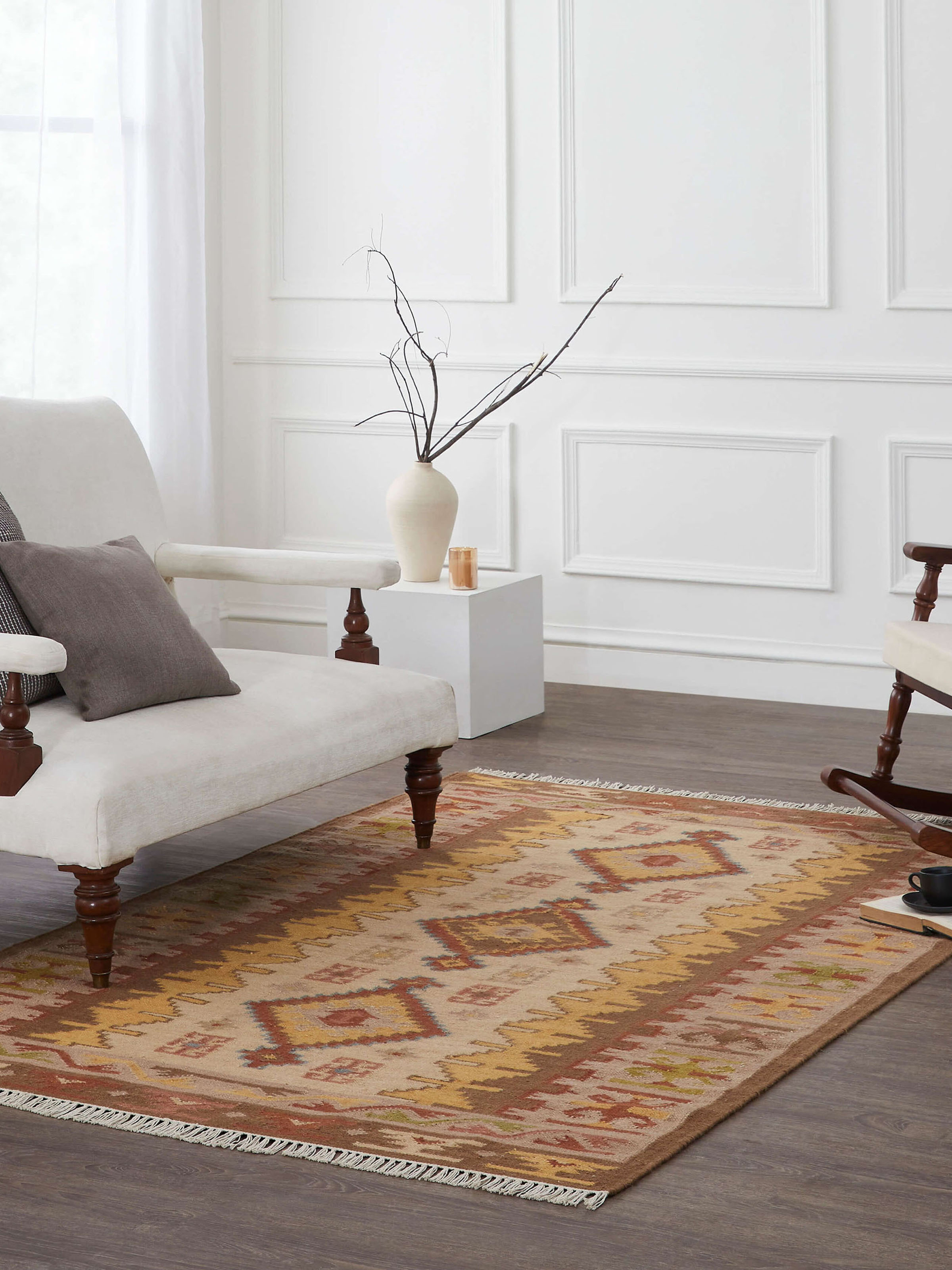 Lifestyle shot: Traditional kilim wool Panja dhurrie styled in a classic room with heritage charm and rustic patterns.