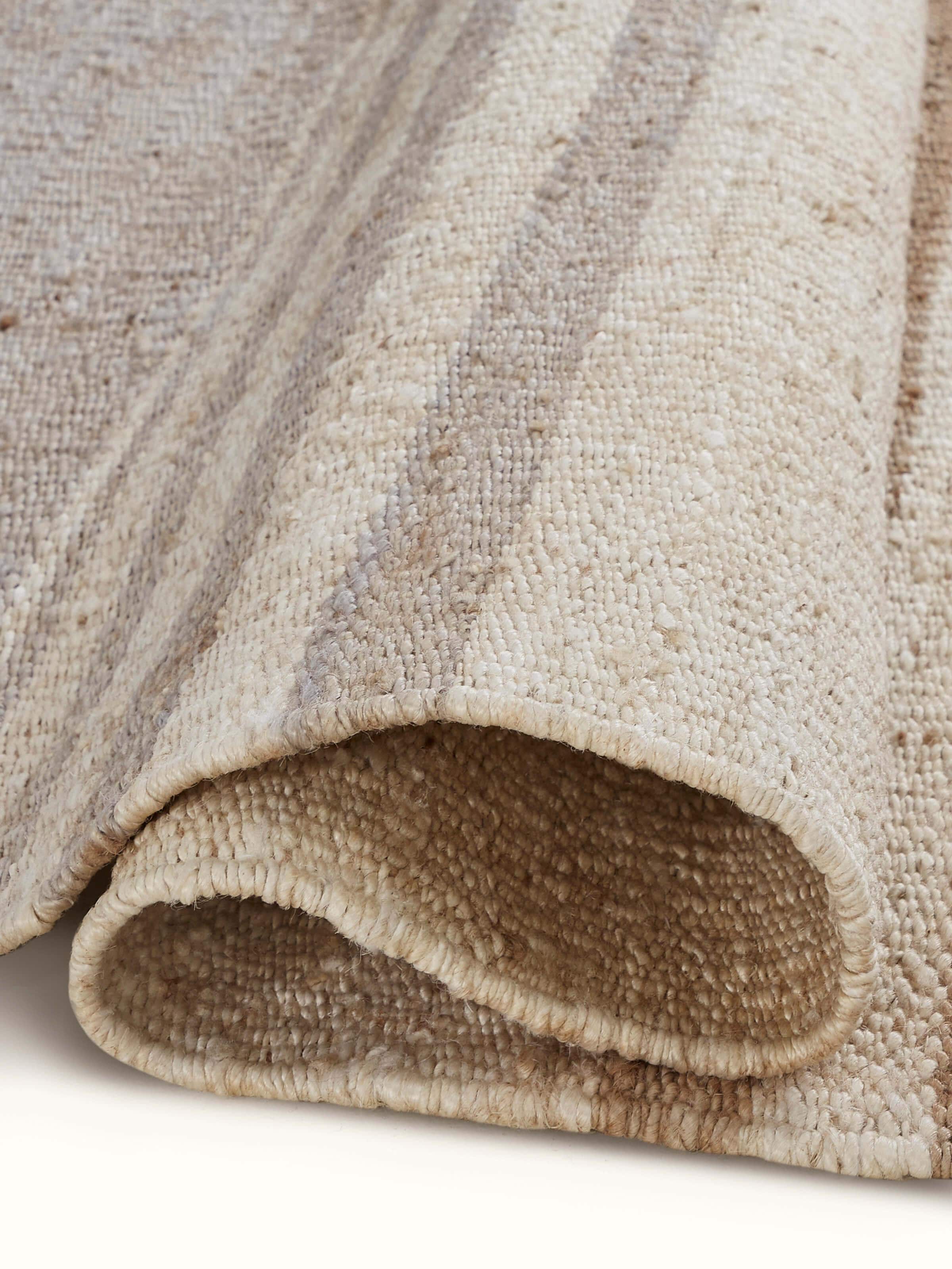 Back view of Graphic geo beige grey jute natural fibre rug focusing on its construction