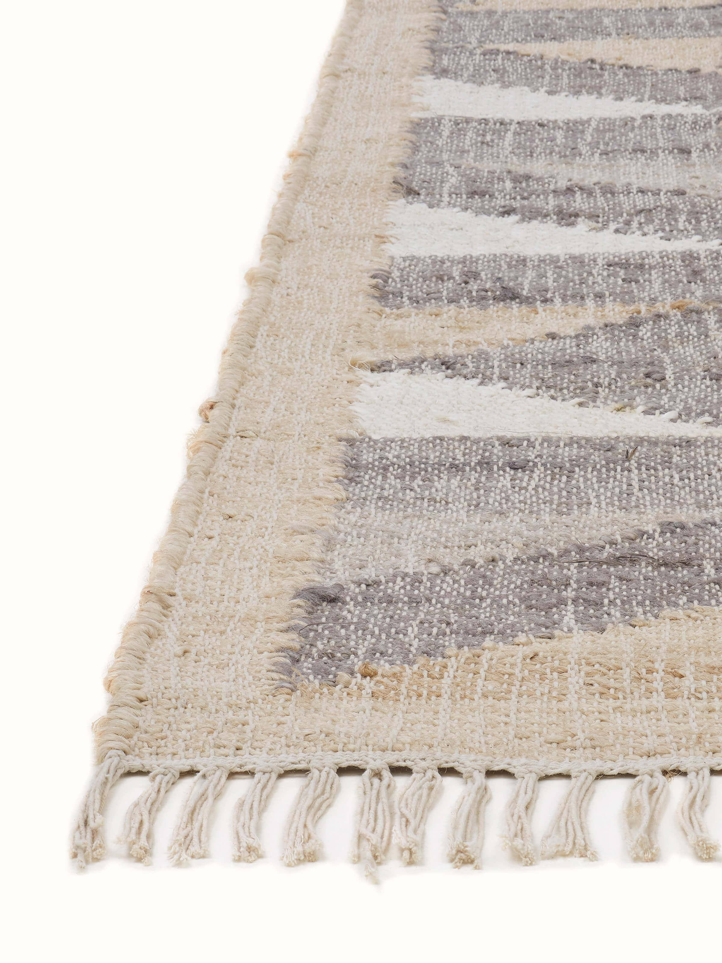 Detailed view of Graphic geo beige brown jute natural fibre rug, focusing on the pattern and material quality.