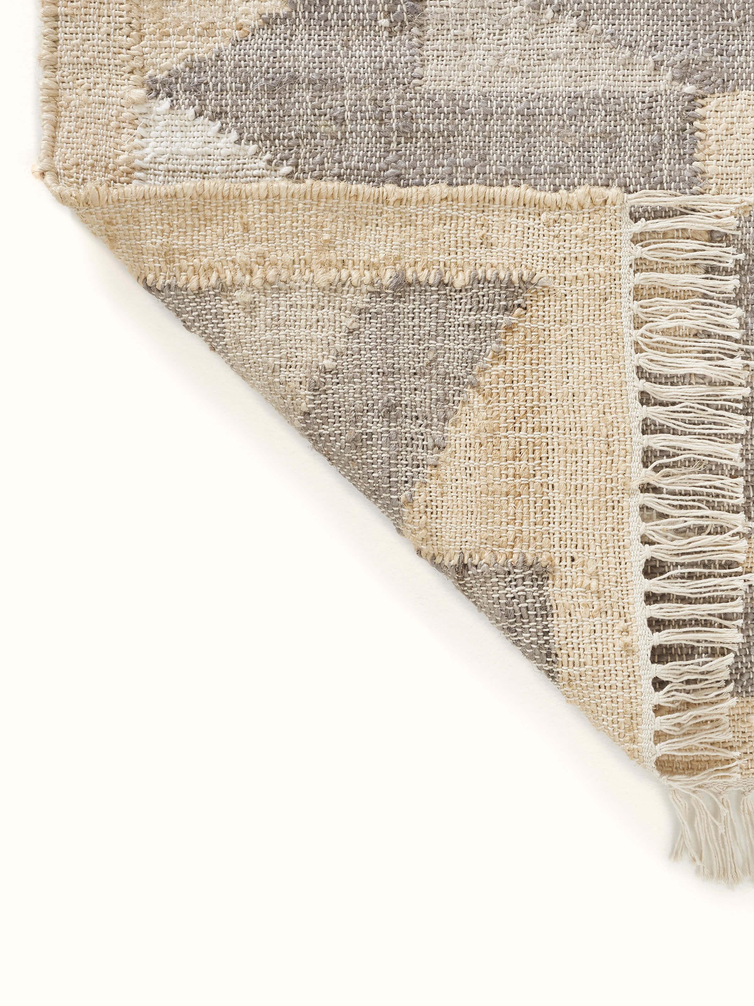 Close-up of Graphic geo beige brown jute natural fibre rug, focusing on the jute texture and design details.
