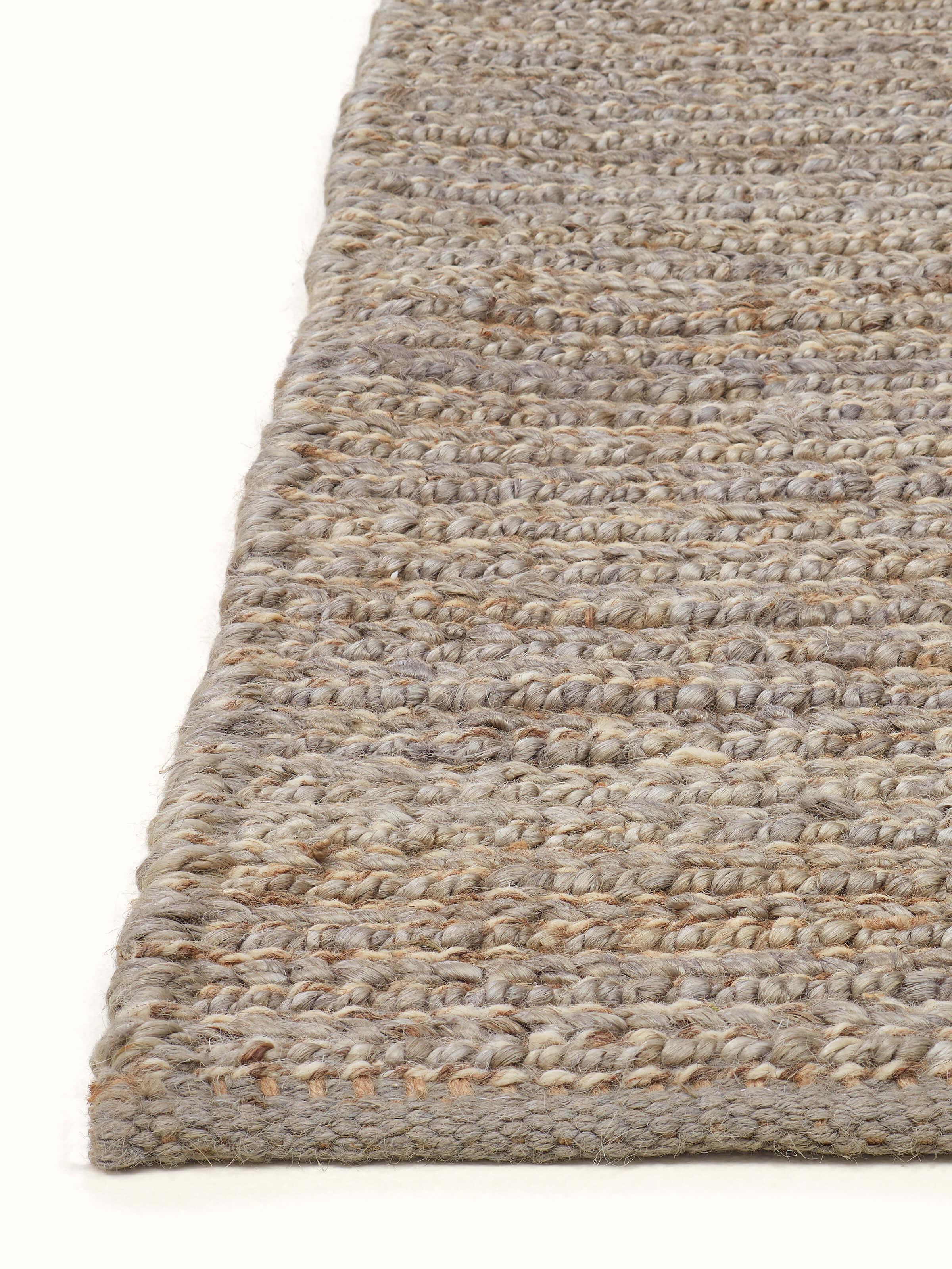 Overhead view of the Textured Solid Grey Jute & Wool Rug, highlighting the rug's texture and design.