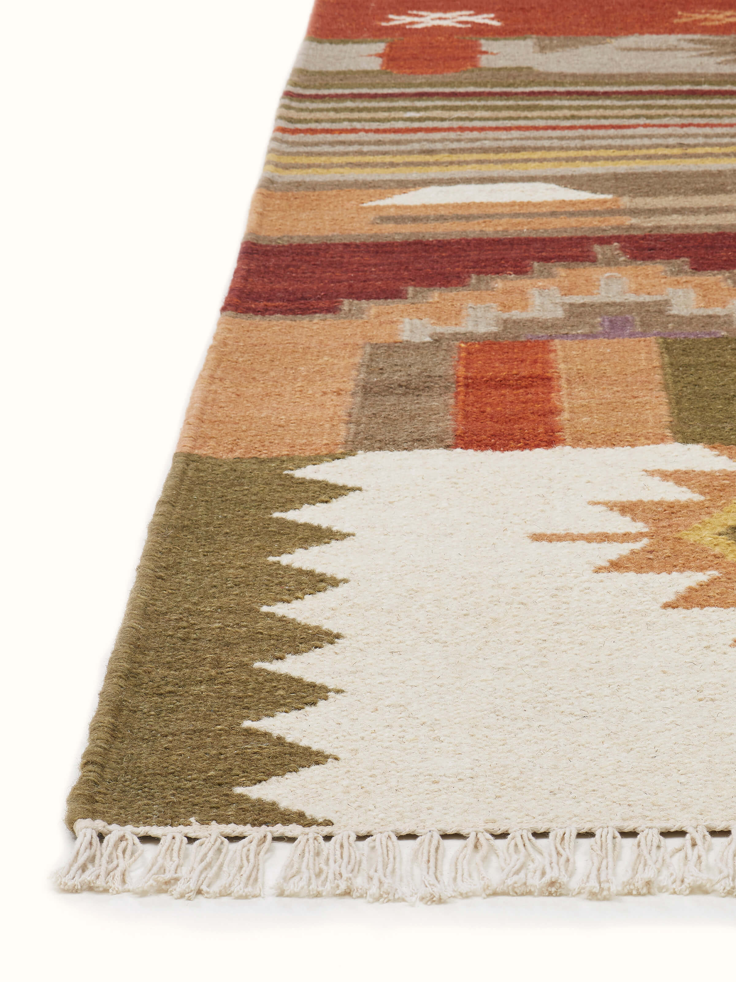 Detailed view of the Kilim Patchwork Orange Wool Panja Dhurrie, focusing on the vibrant orange hues and patchwork detailing.