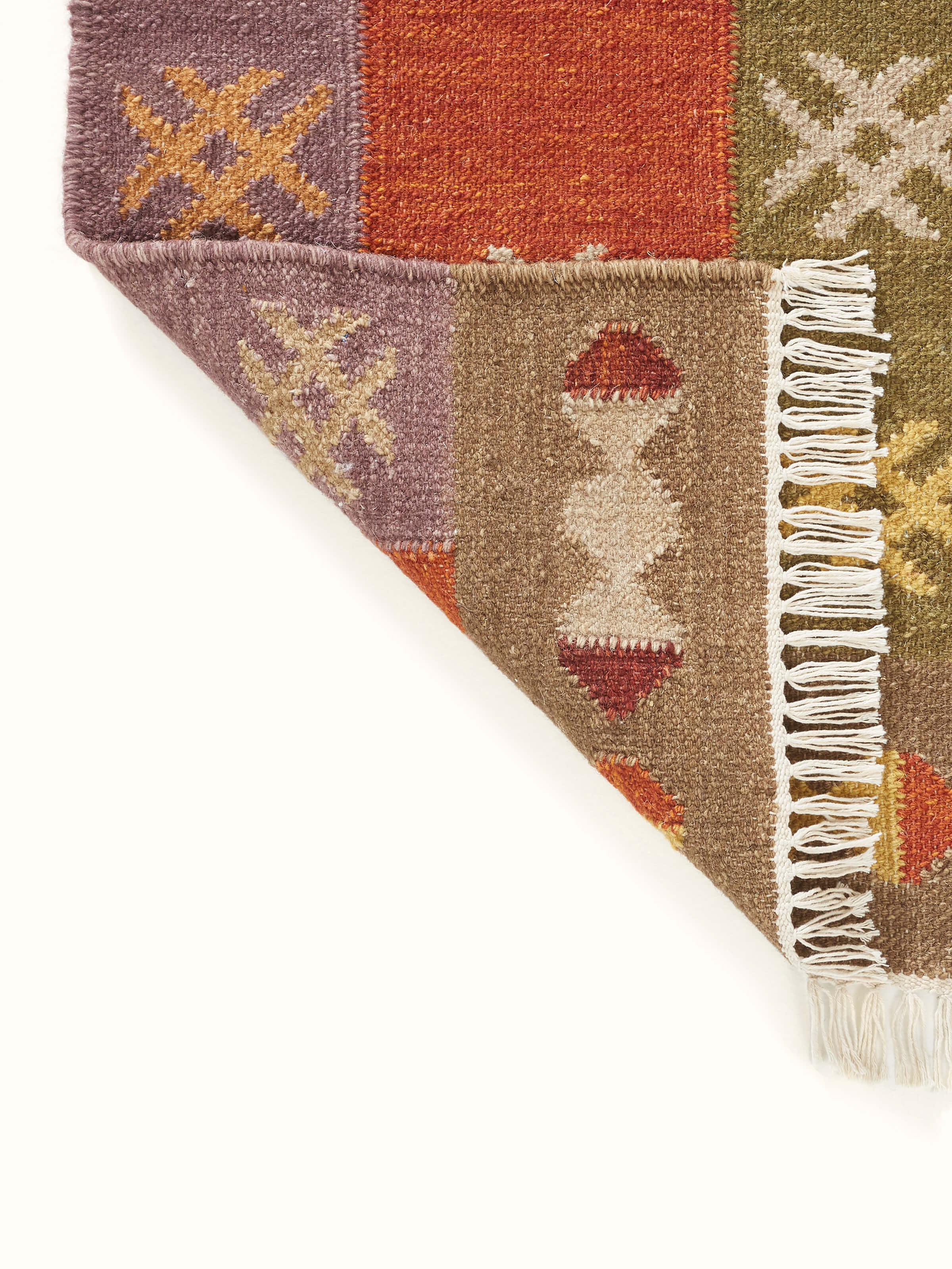 Full view of Kilim Patchwork Orange Wool Panja Dhurrie laid out on the floor, illustrating its practical use and aesthetic appeal.