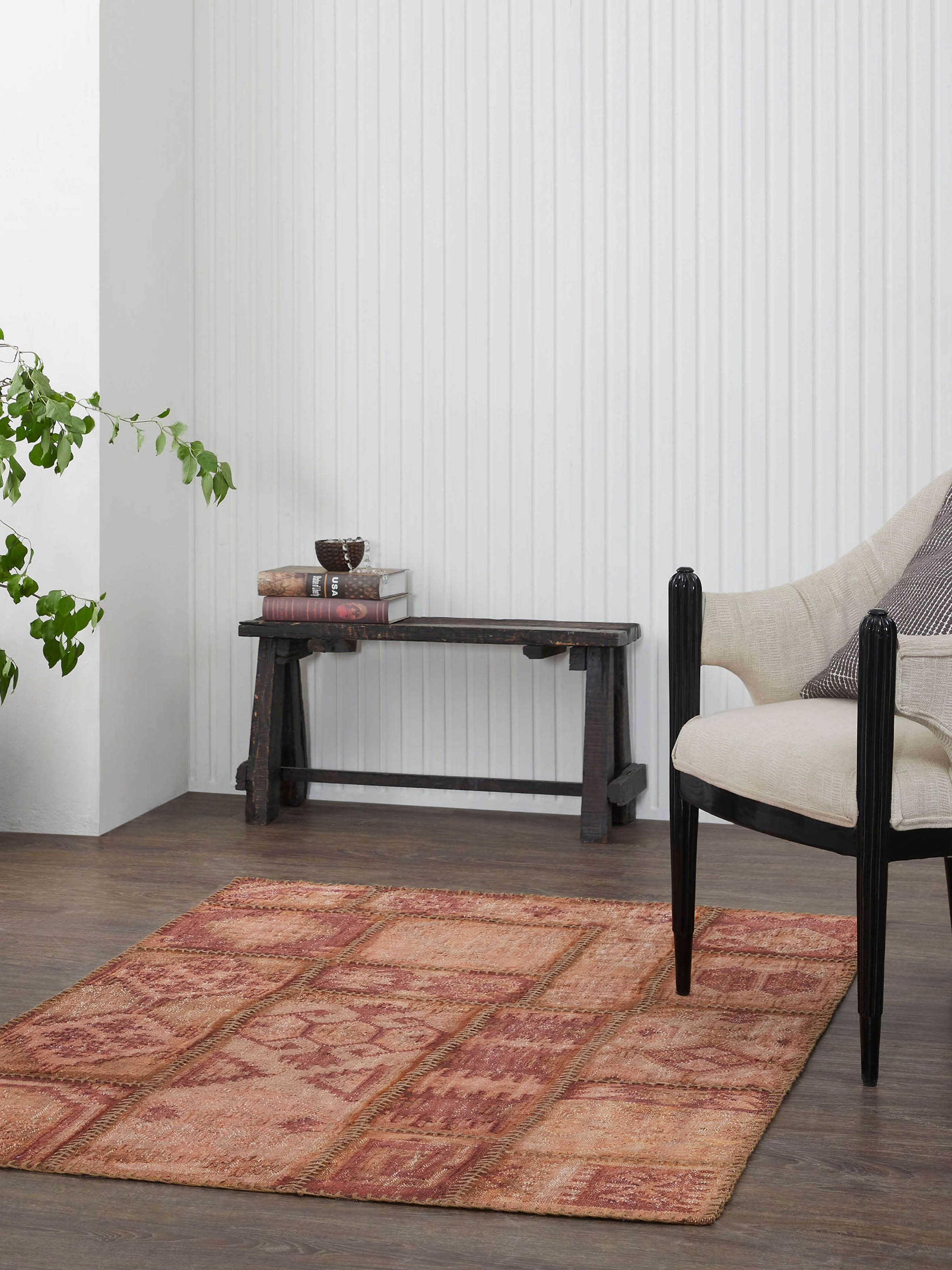 Lifestyle image of antique rust wool Kilim patchwork Panja dhurrie on floor display