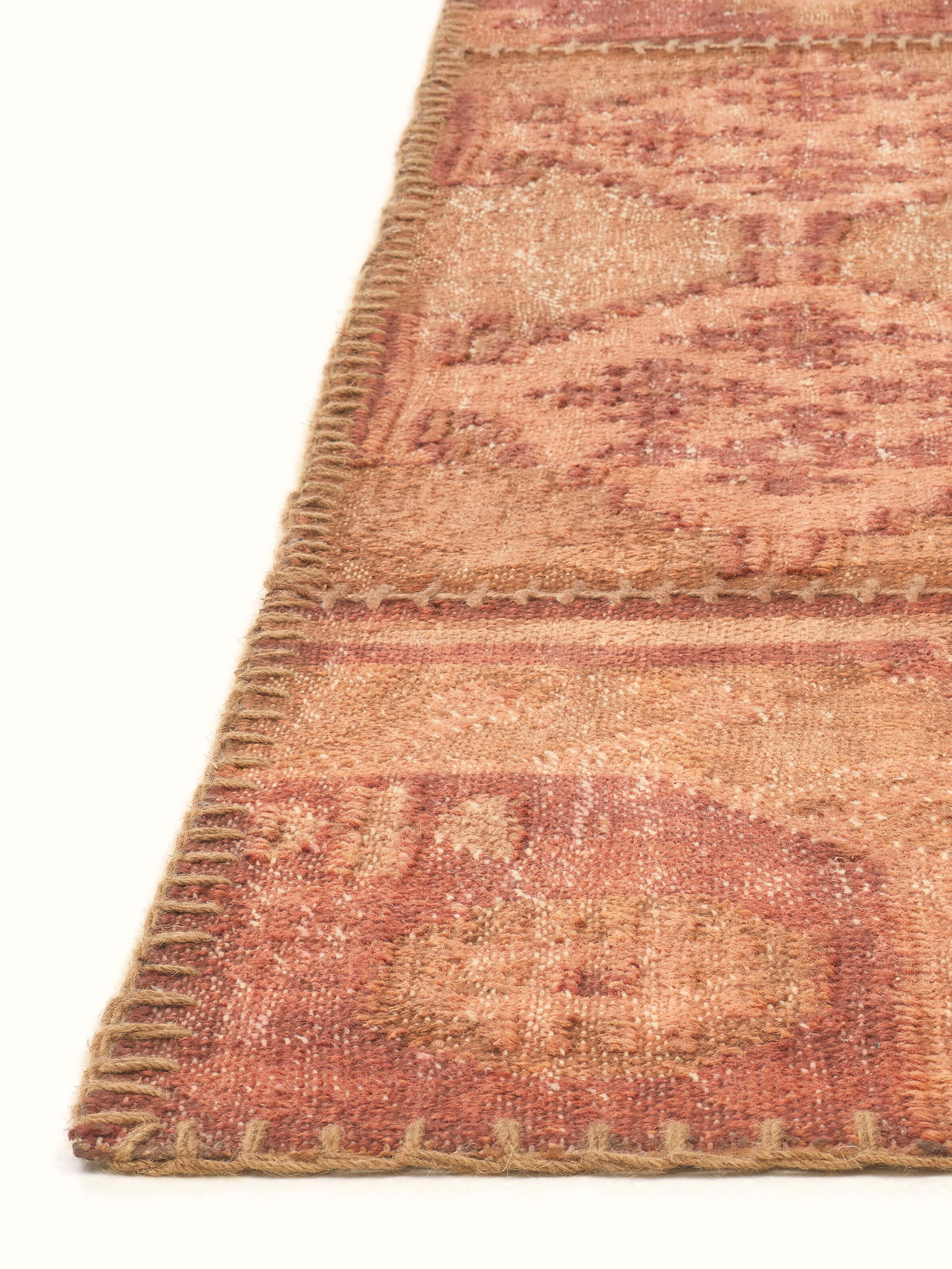 Detailed view of Kilim patchwork antique rust wool panja dhurrie focusing on the texture and color variations of the patchwork design.