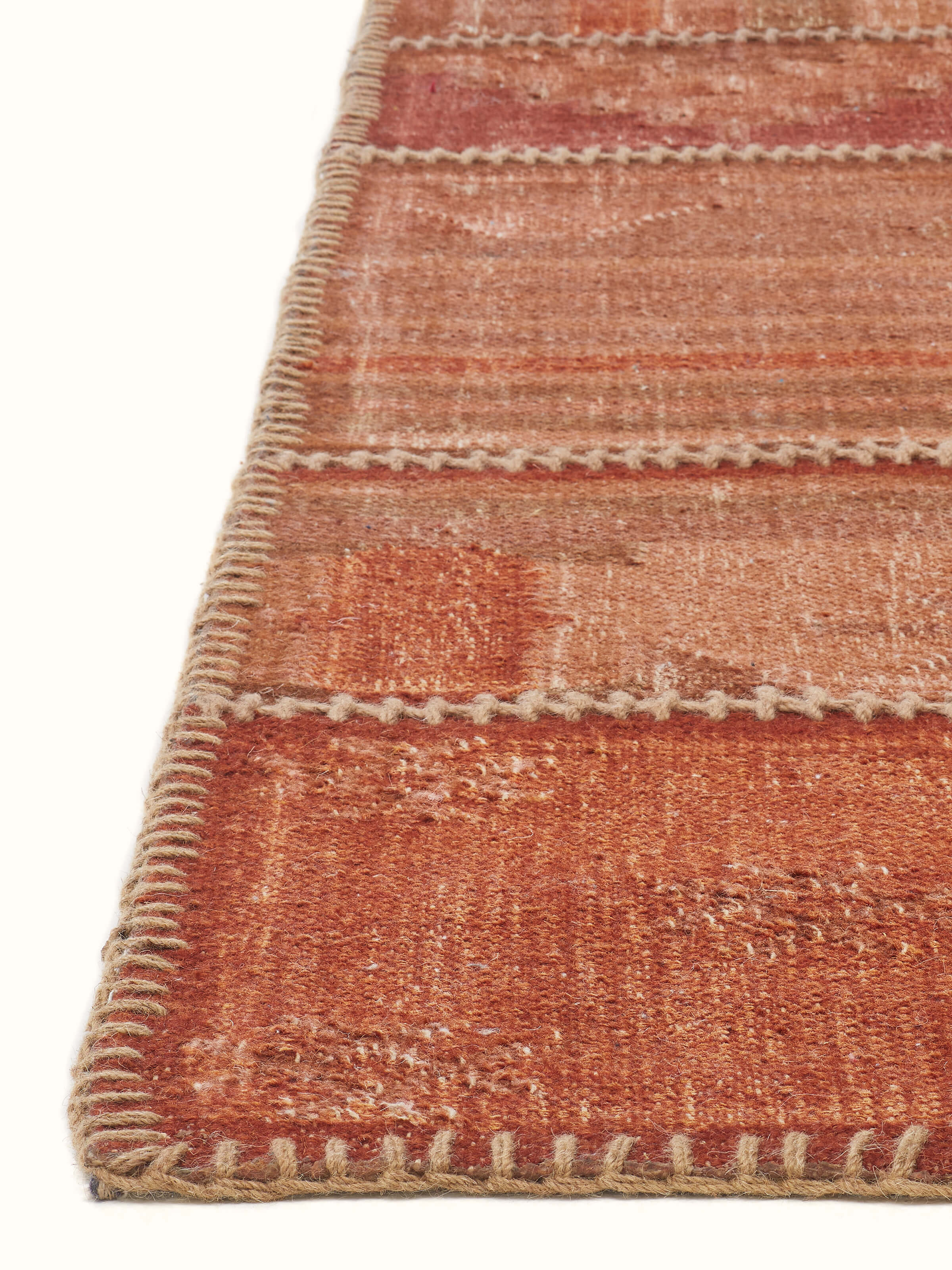 Detailed view of Kilim patchwork antique red wool panja dhurrie, highlighting the texture and intricate design