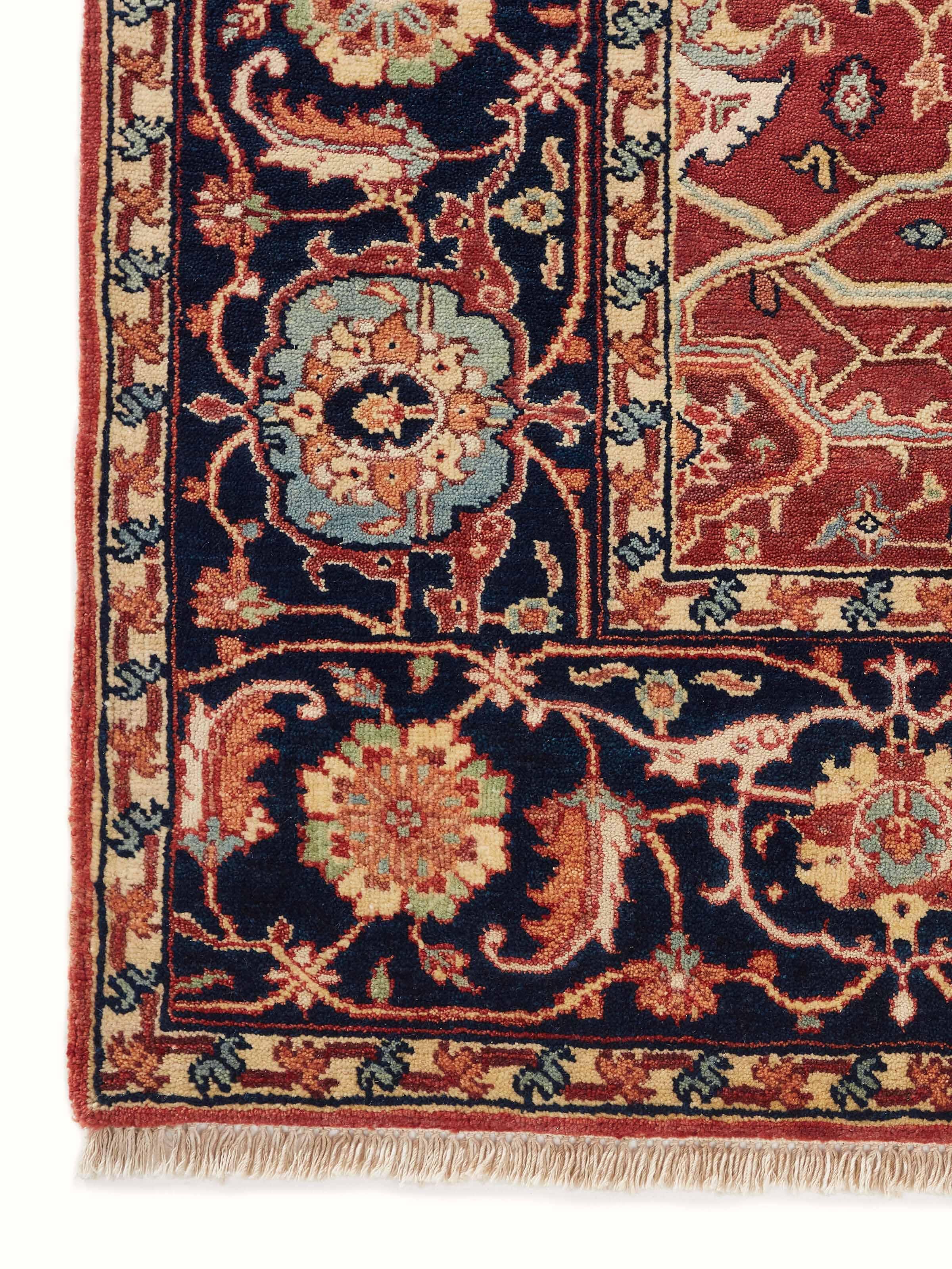 Full view of the Traditional Heriz red Bhadohi wool hand-knotted rug, displaying the rug's size and vibrant color.