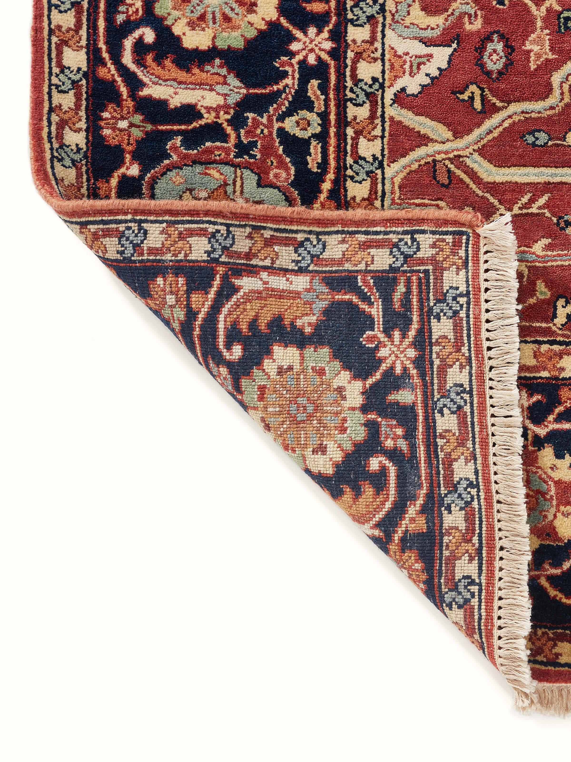 Traditional Heriz red Bhadohi wool hand-knotted rug, highlighting the overall design and craftsmanship of the rug.