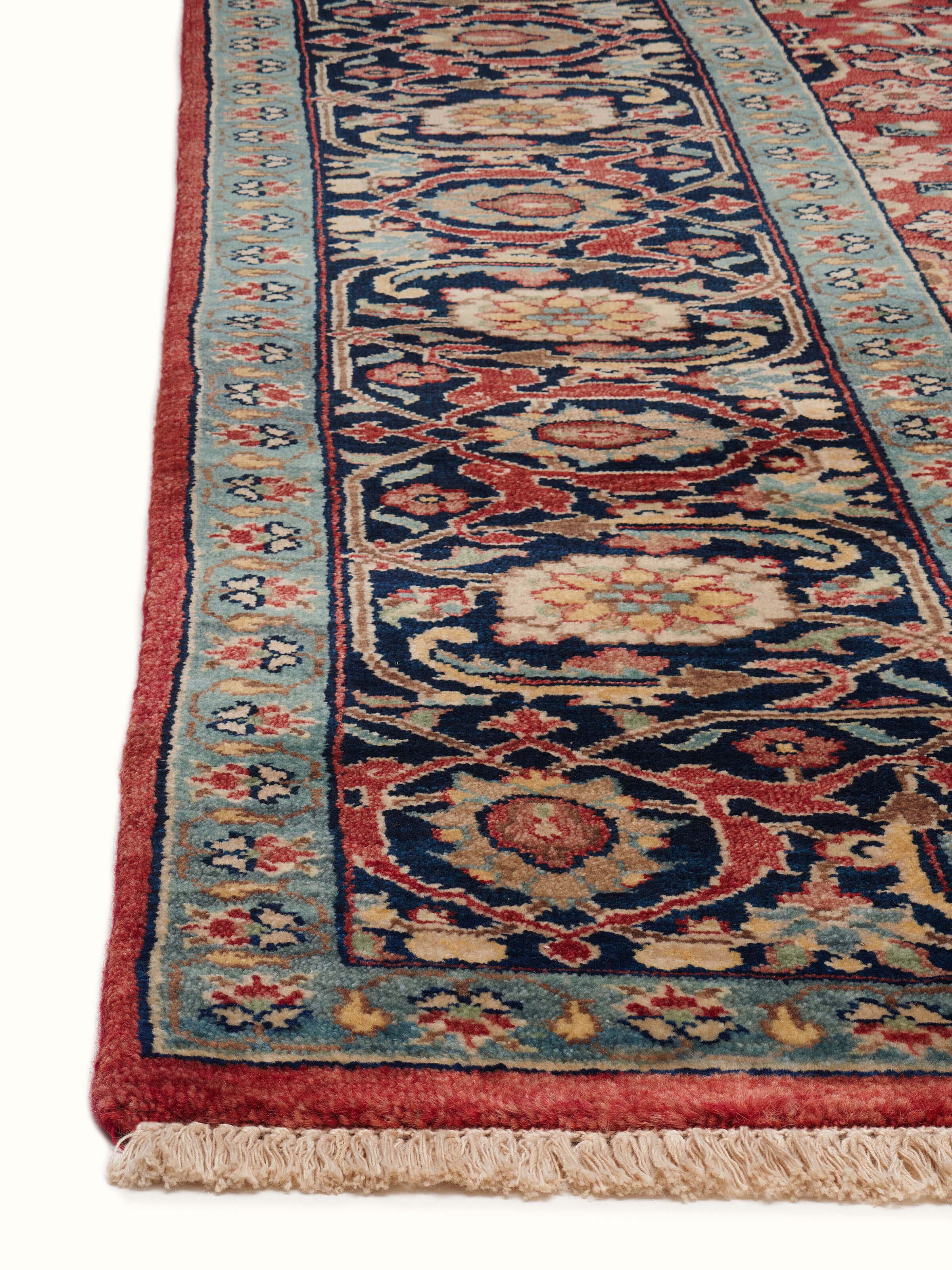 Detailed close-up of Traditional mahal red Bhadohi wool hand-knotted rug showing the weave and pattern