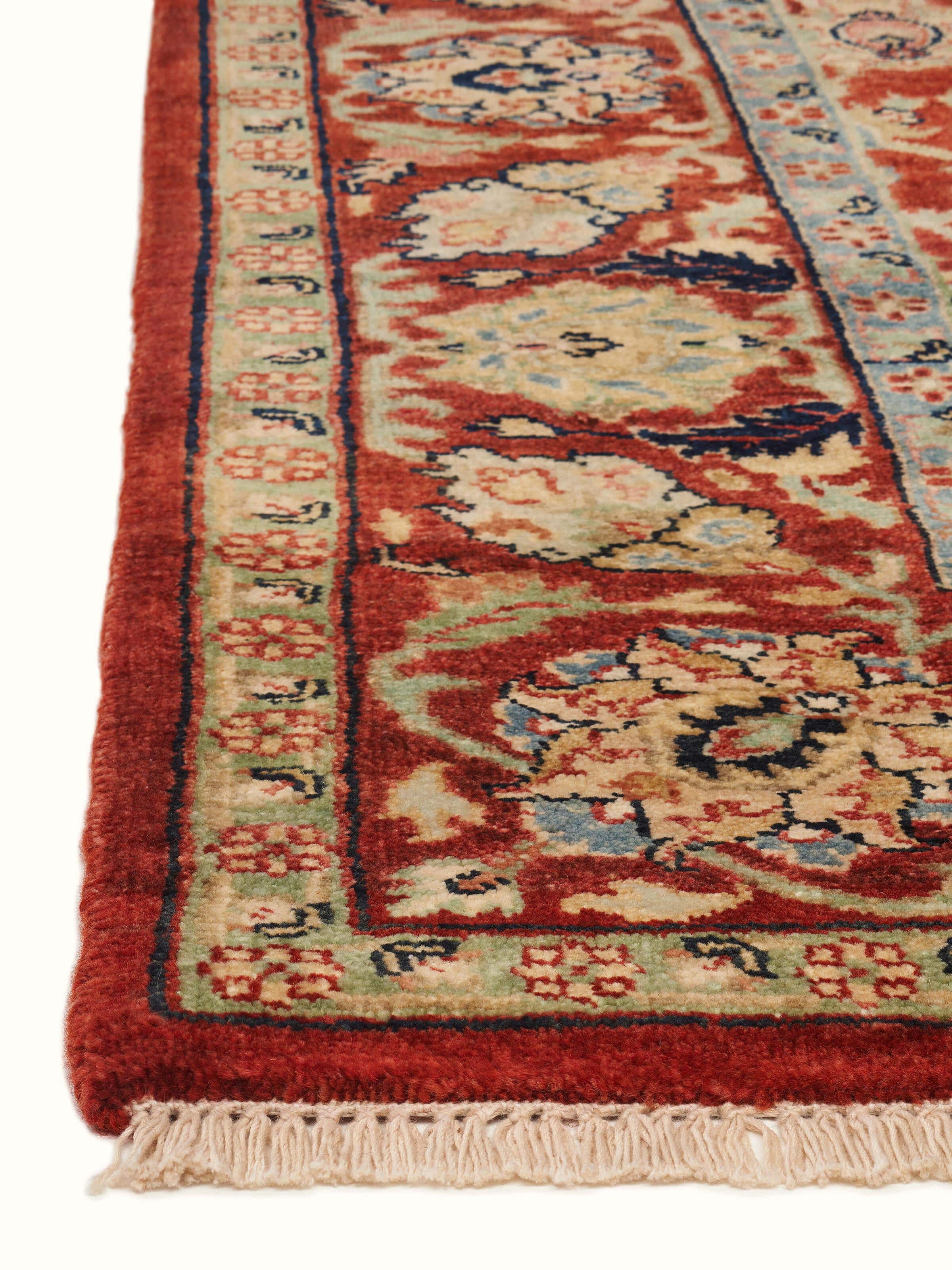 Side view of Traditional Polonise rust Bhadohi wool hand-knotted rug highlighting its depth and craftsmanship.
