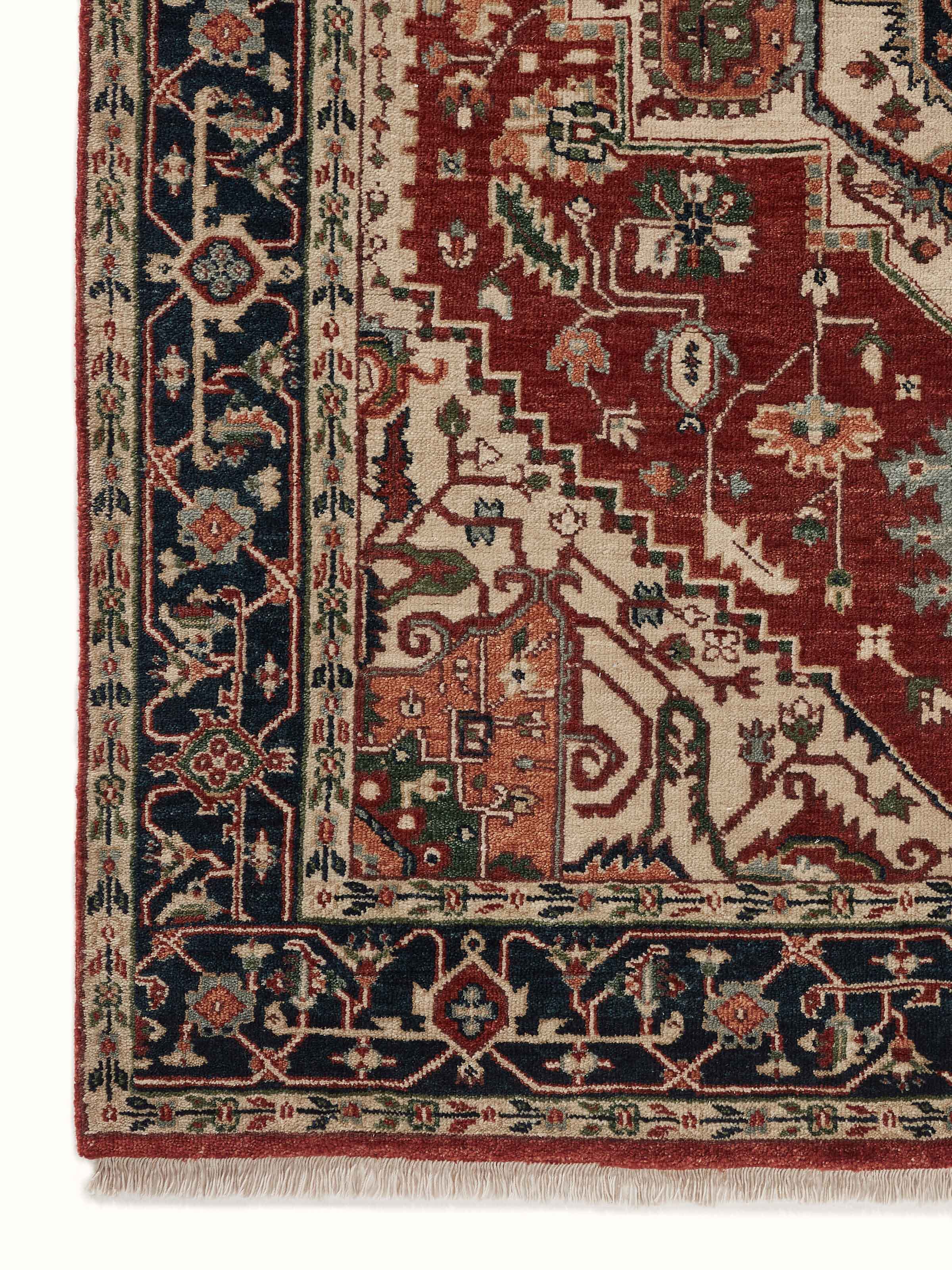 Detailed shot of Traditional Heriz rust Bhadohi wool hand-knotted rug showing fine texture and color richness